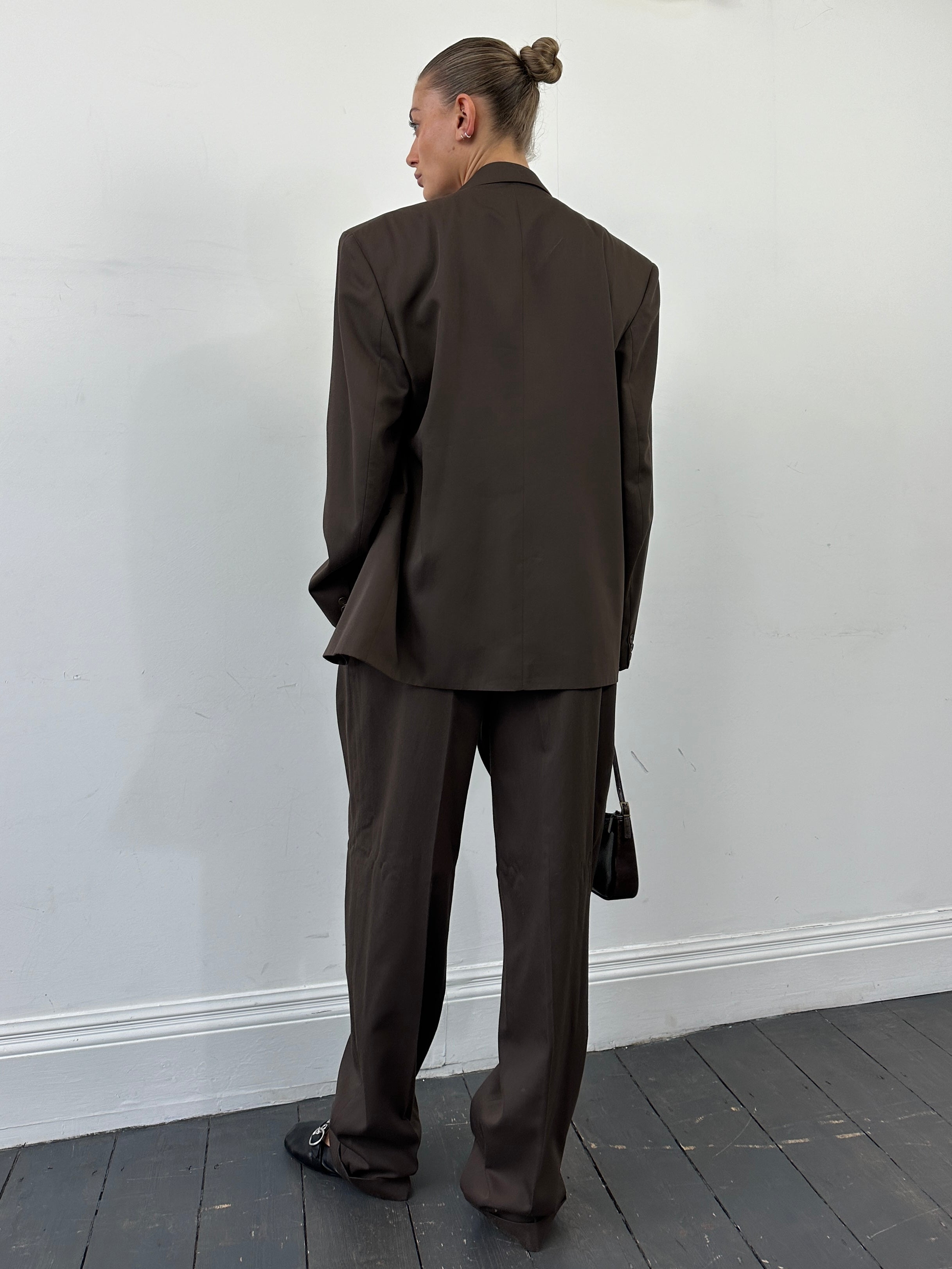 Vintage double-breasted suit jumpsuit in size 40R/W32, featuring classic tailored design and retro style.