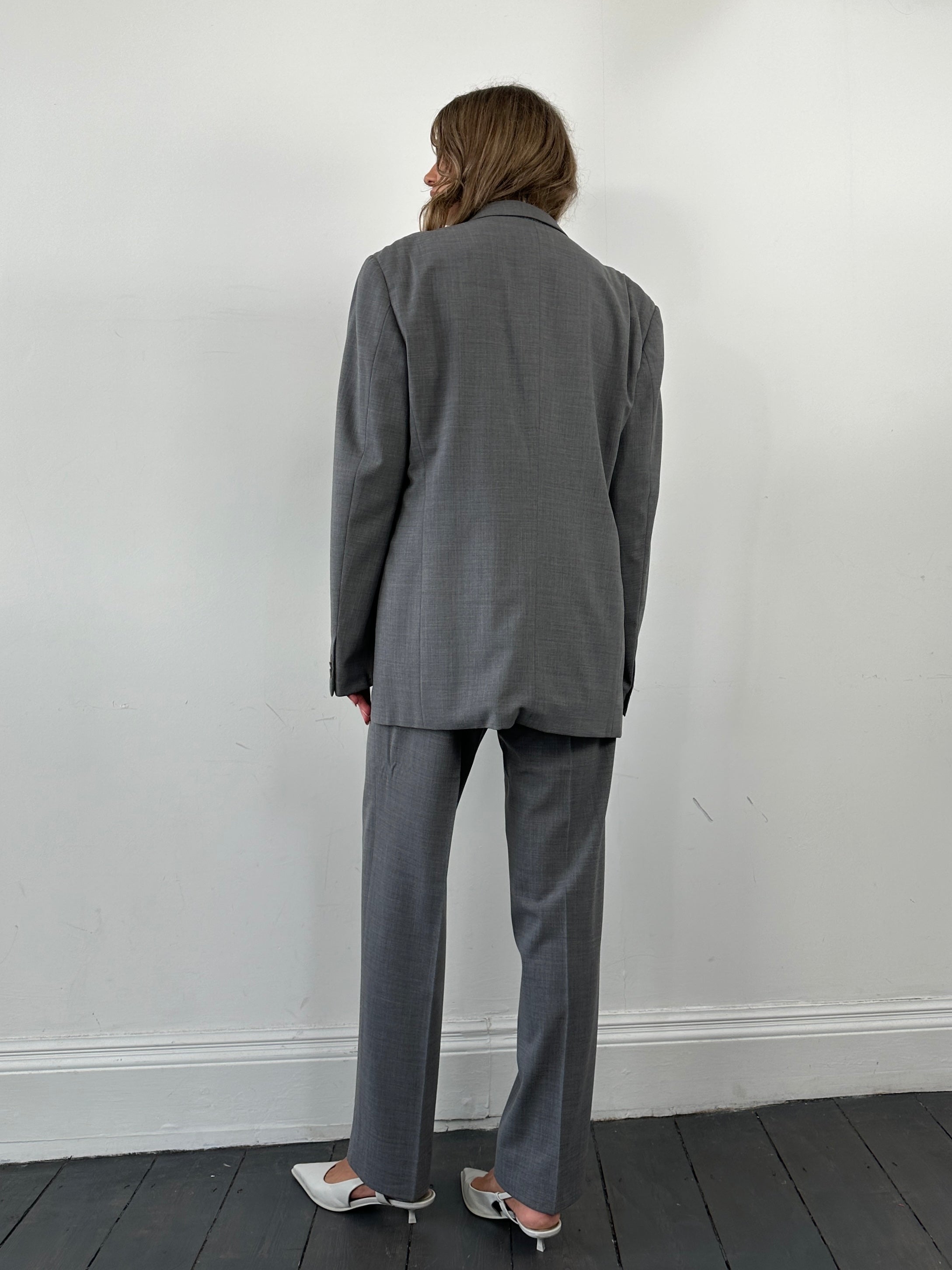Armani Collezioni relaxed virgin wool single-breasted suit jumpsuit in size 40R/W32, shown in a tailored, professional fit.