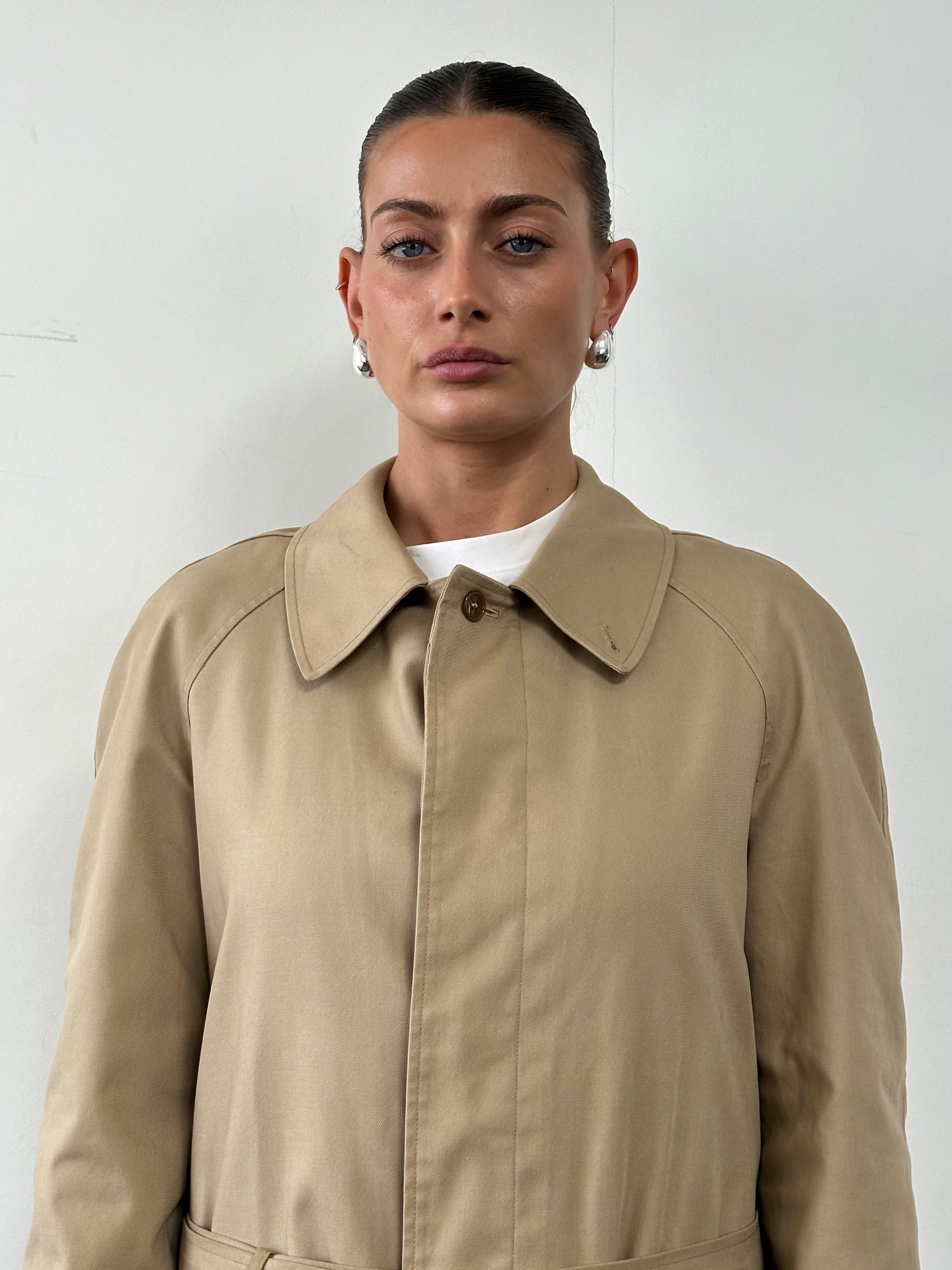 Vintage cotton belted trench coat in XL, featuring classic design and double-breasted front, perfect for stylish outerwear.