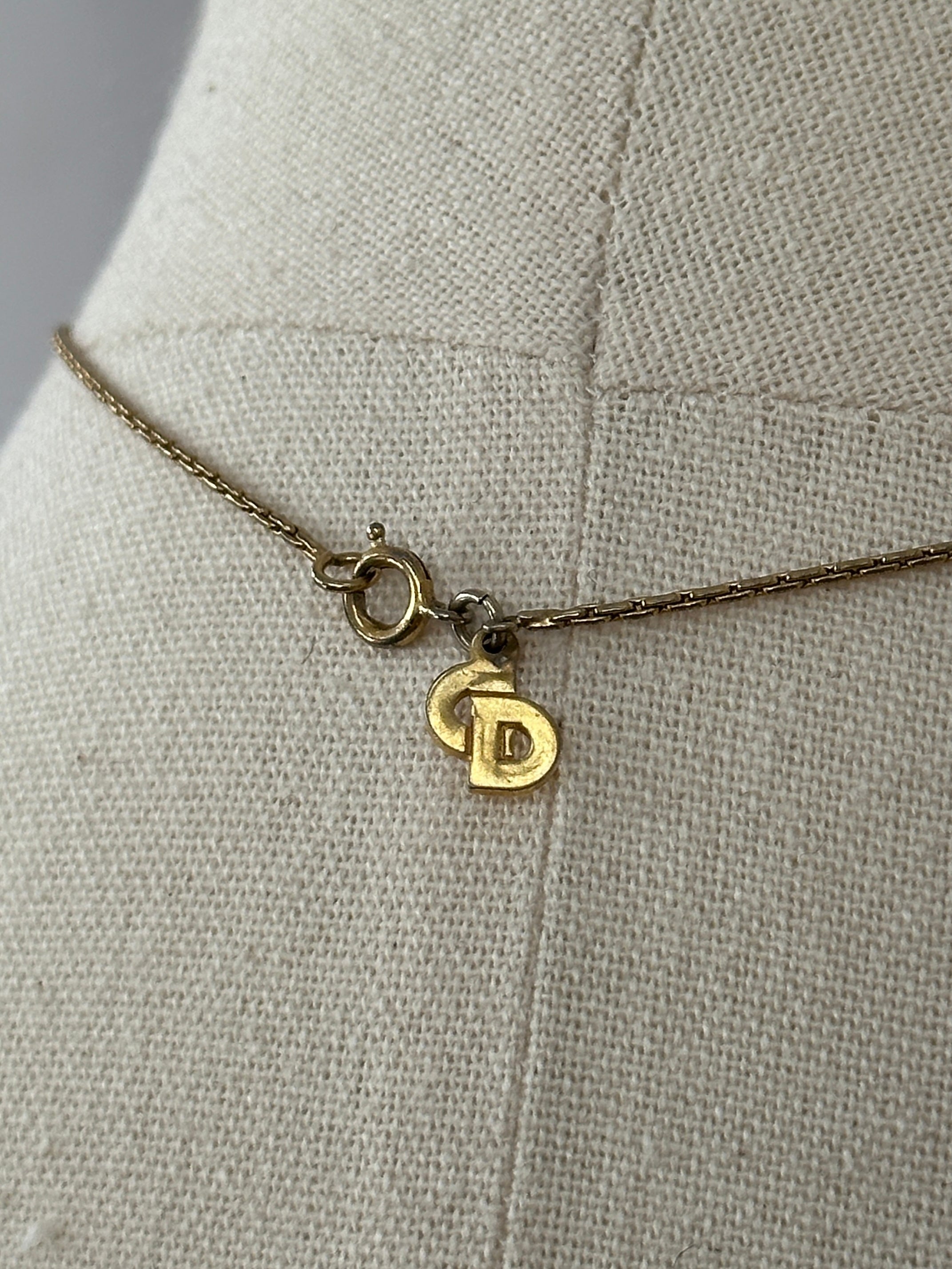 Christian Dior 1990s gold plated CD logo pendant necklace, 16-inch chain, featuring a prominent Christian Dior emblem.