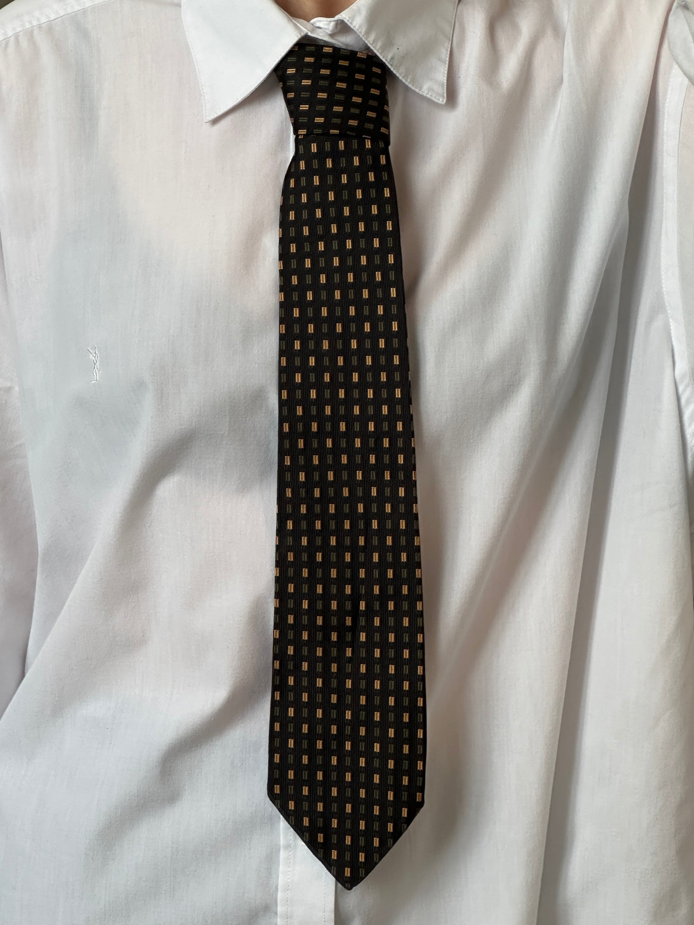 Vintage Japanese 1990s pure silk geometric tie featuring bold patterns and vibrant colors, ideal for formal or stylish occasions.