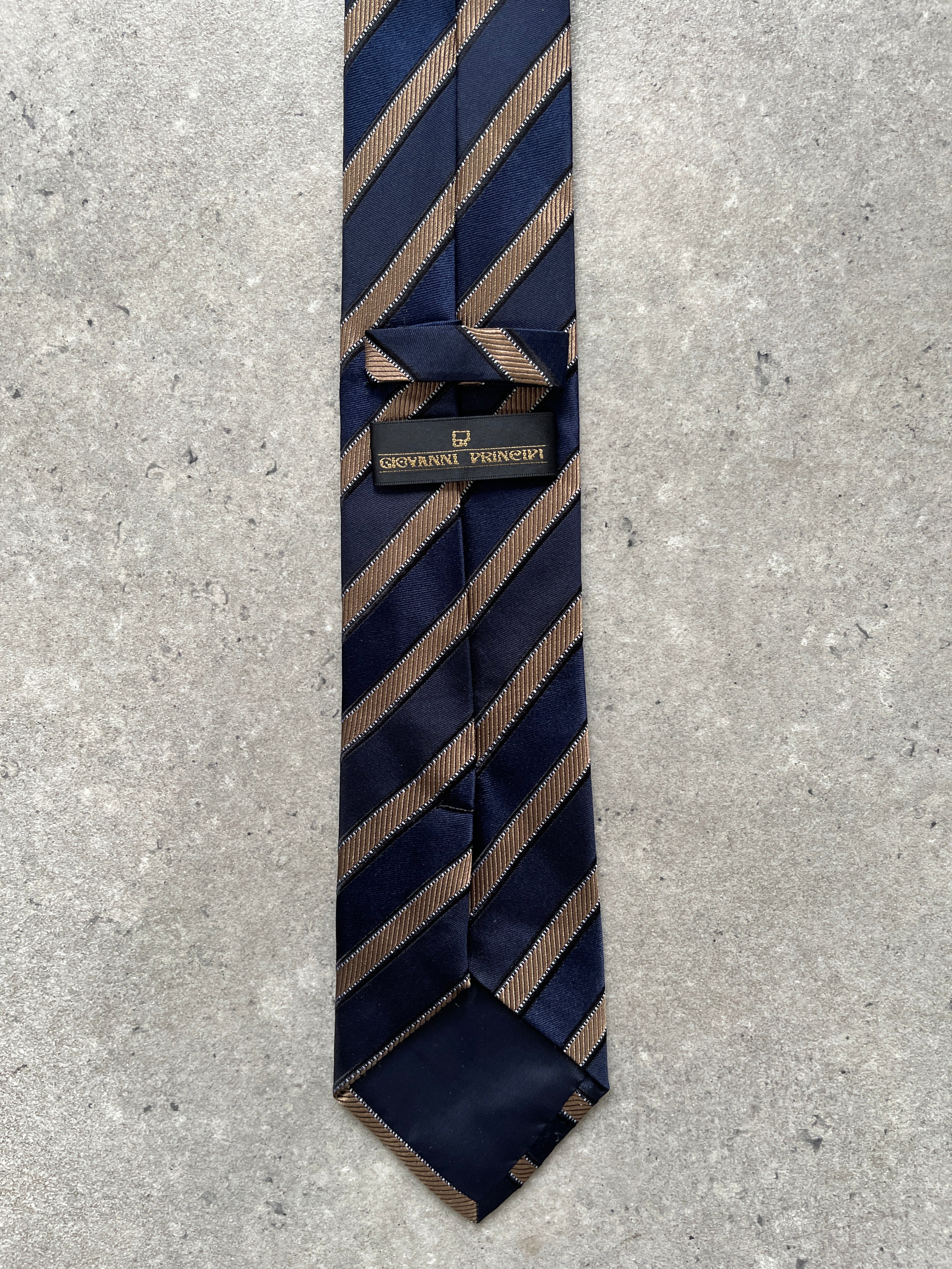 Vintage 1990s pure silk diagonal striped tie, classic men's accessory with elegant pattern and smooth fabric texture.