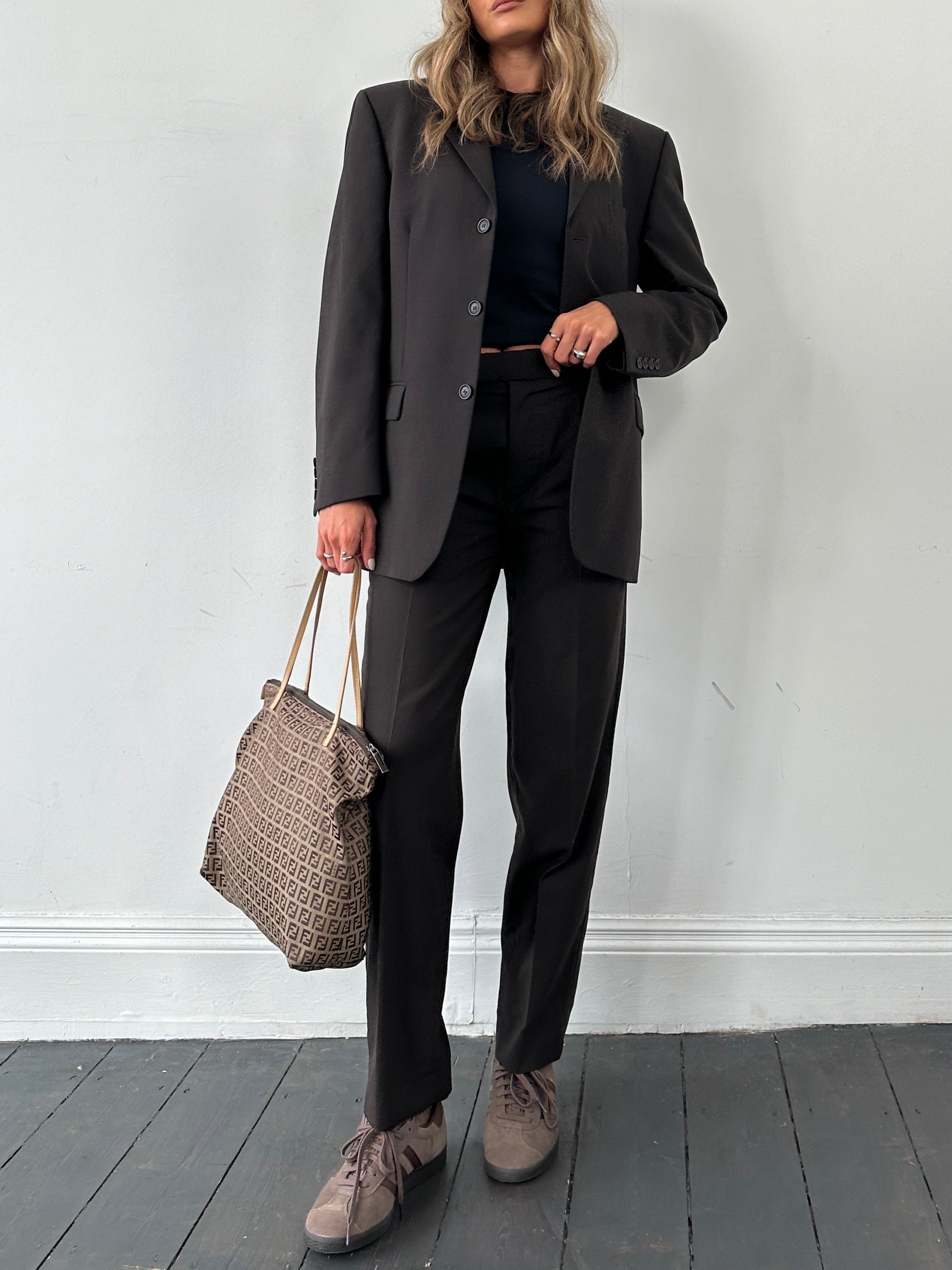 Vintage wool single-breasted jumpsuit in size 38R/W28, featuring classic tailored details and a timeless vintage style.