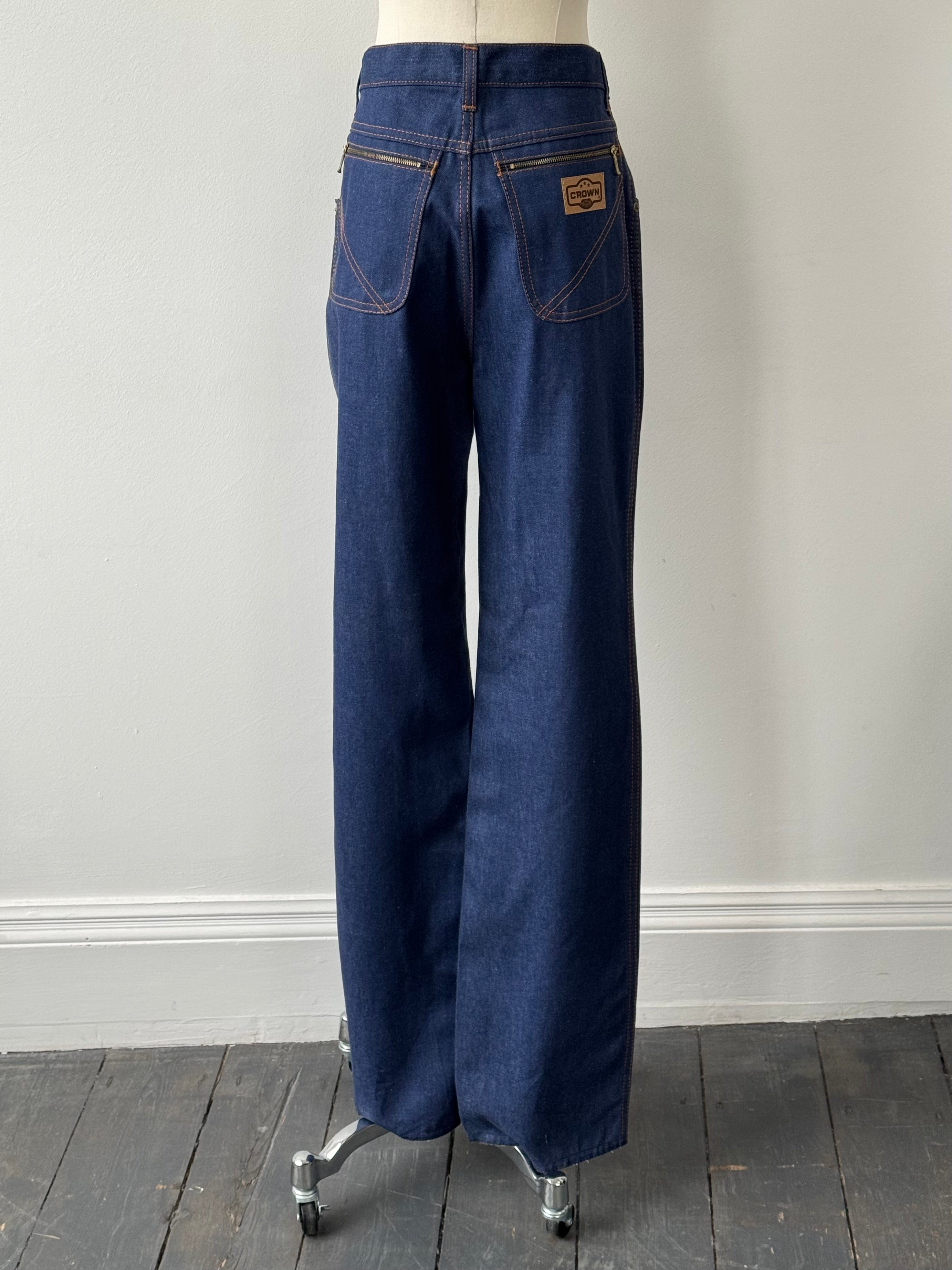 Vintage Italian 1990s straight leg high waisted denim jeans, W28, with classic blue wash and vintage stitching details.