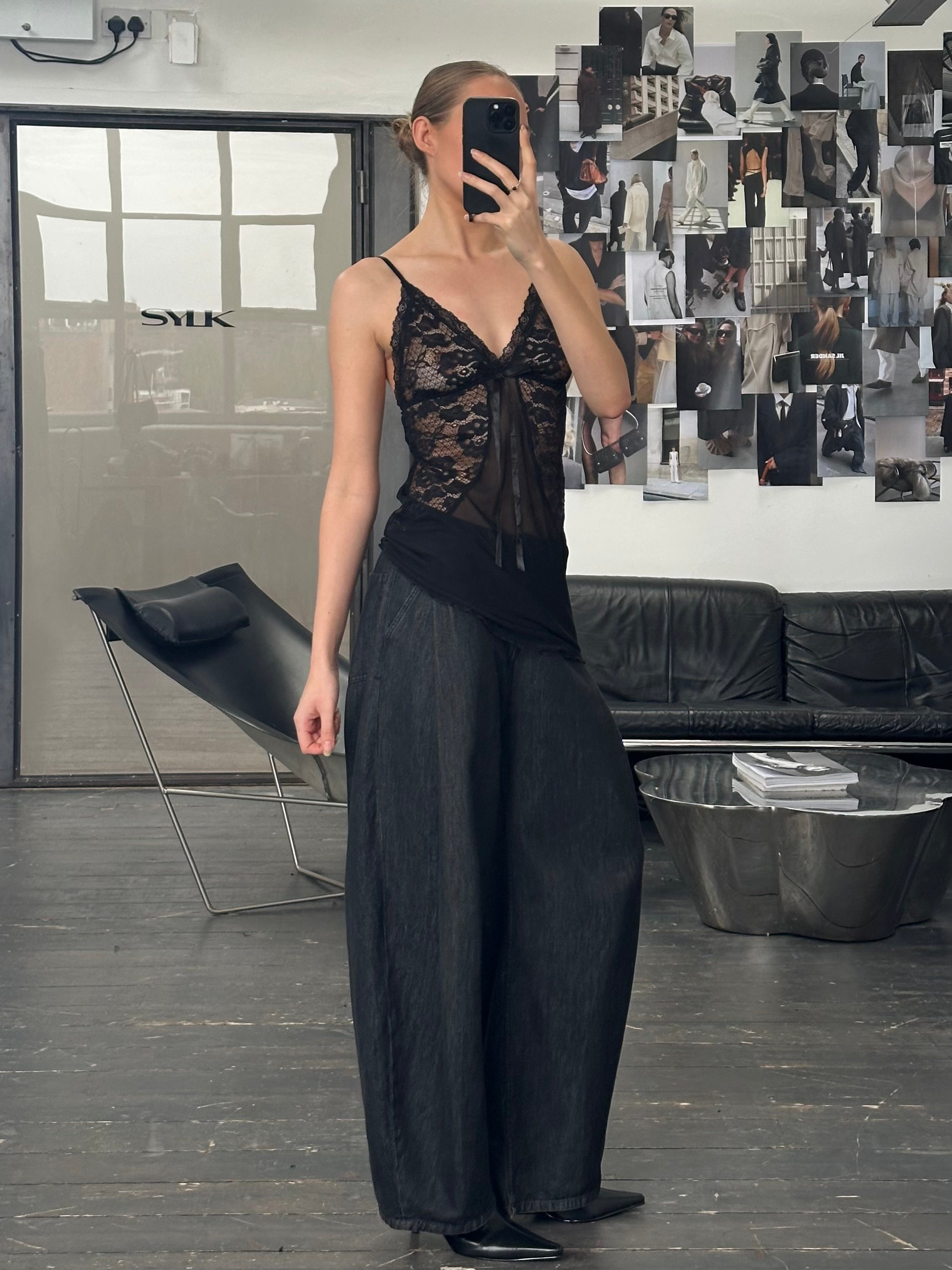 Vintage 1990s sheer lace top in size small, featuring delicate lightweight fabric and intricate lace details.