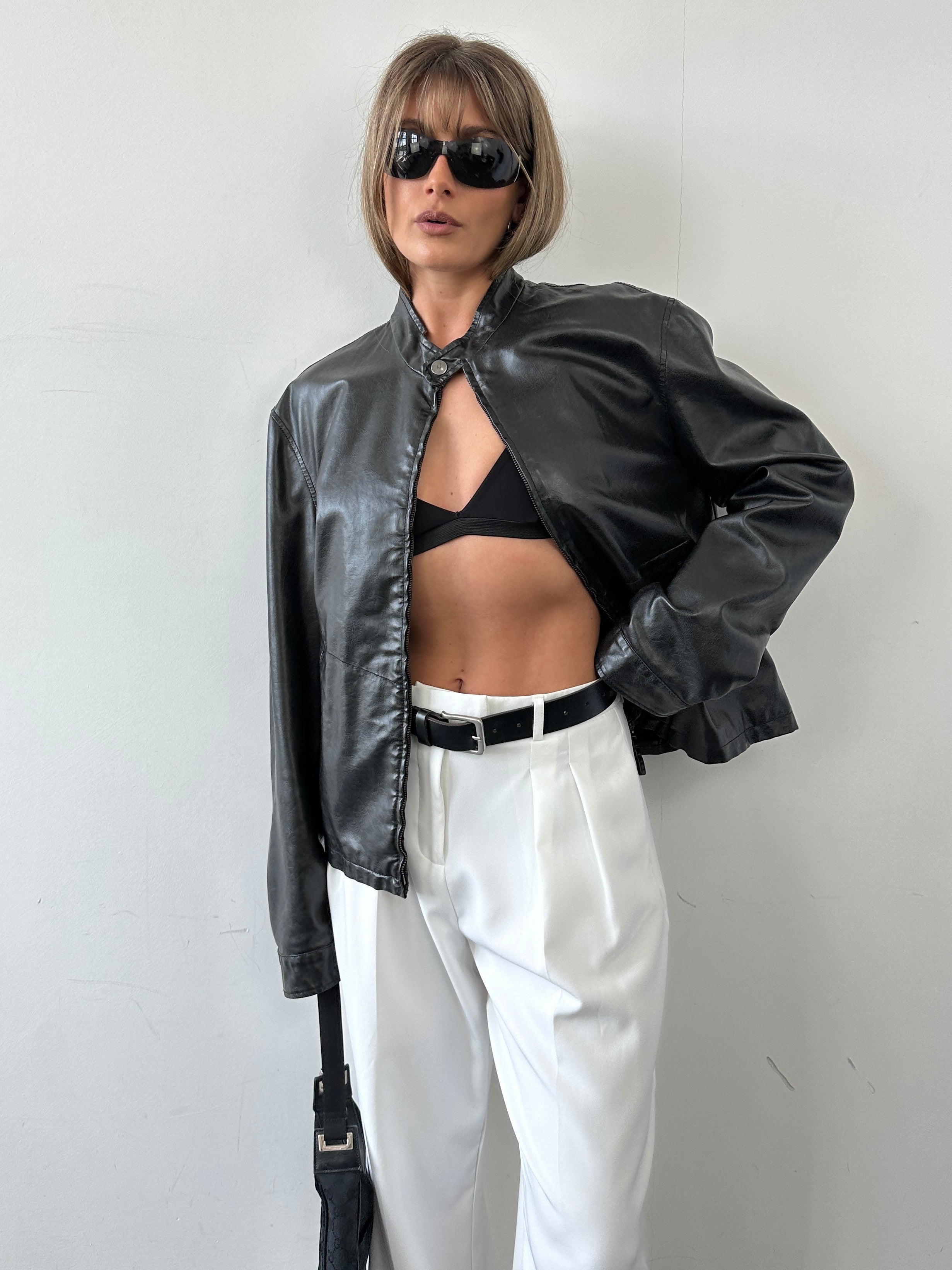 Armani Jeans faux leather biker jacket in size M, featuring classic motorcycle style with silver hardware and a fitted silhouette.
