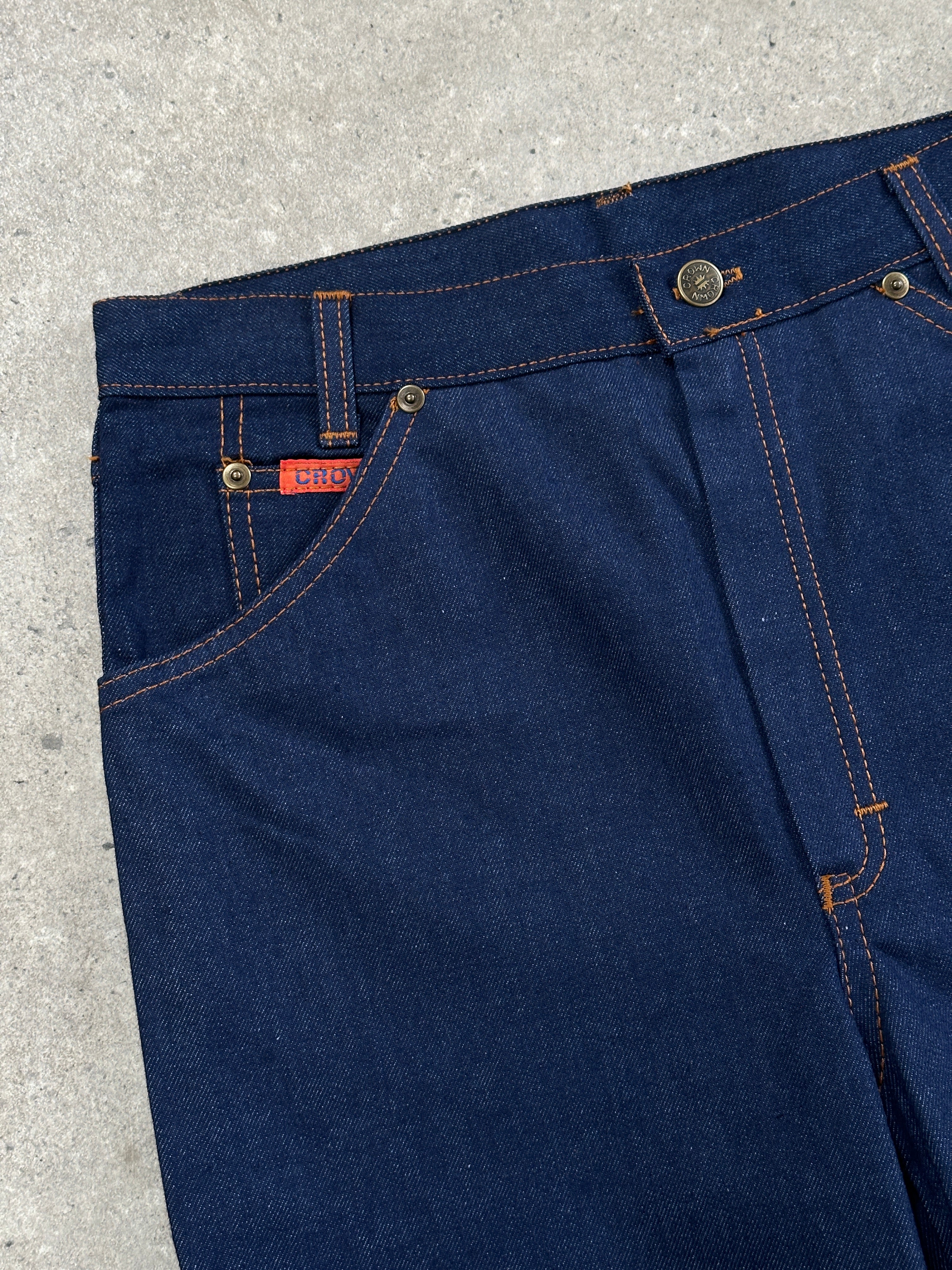 Vintage Italian 1990s high-waisted straight-leg denim jeans, size W28, showing classic blue denim with vintage details.