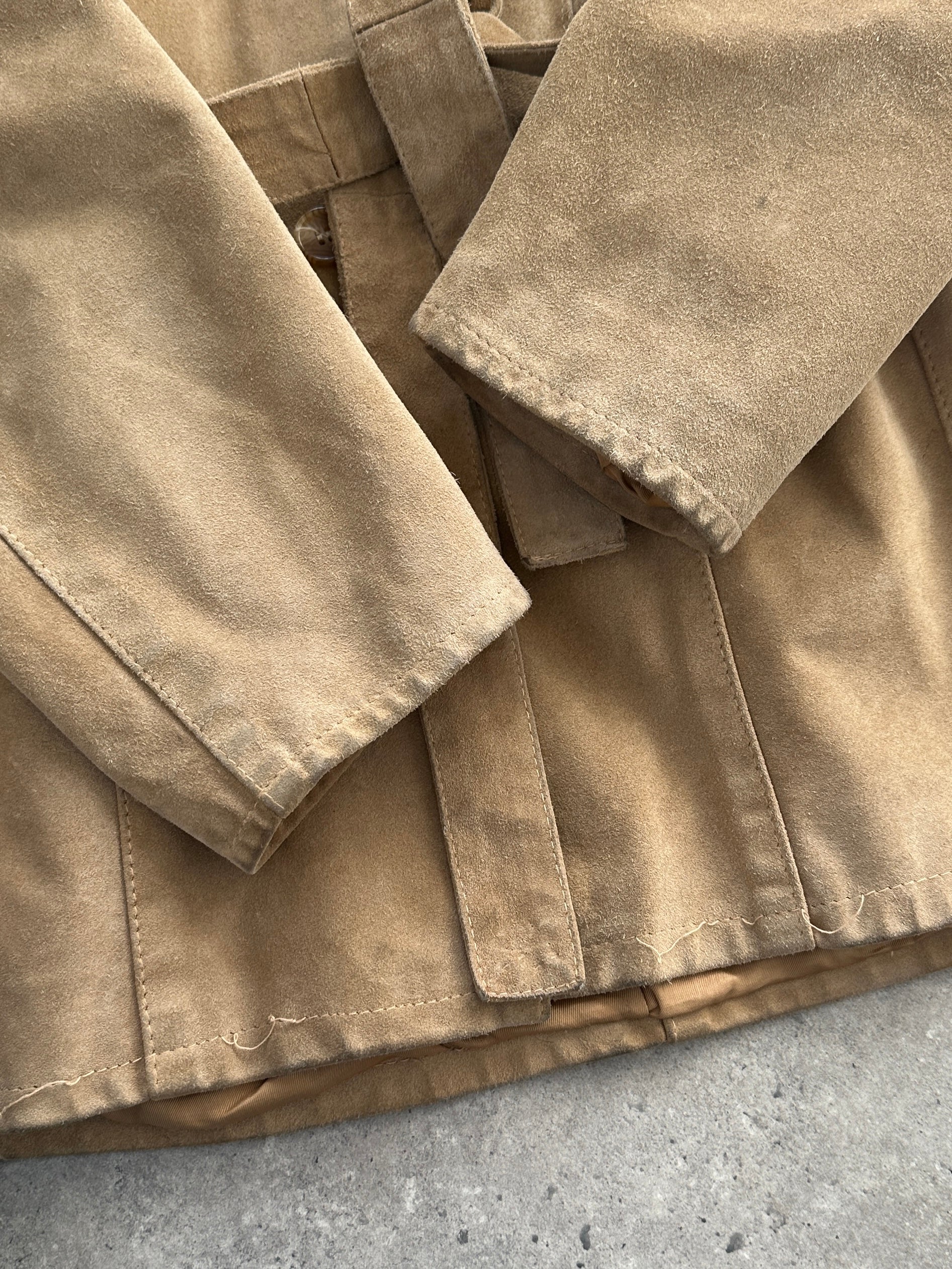Vintage Italian suede belted jacket shown in natural light, featuring classic design and a relaxed fit in size S/M.