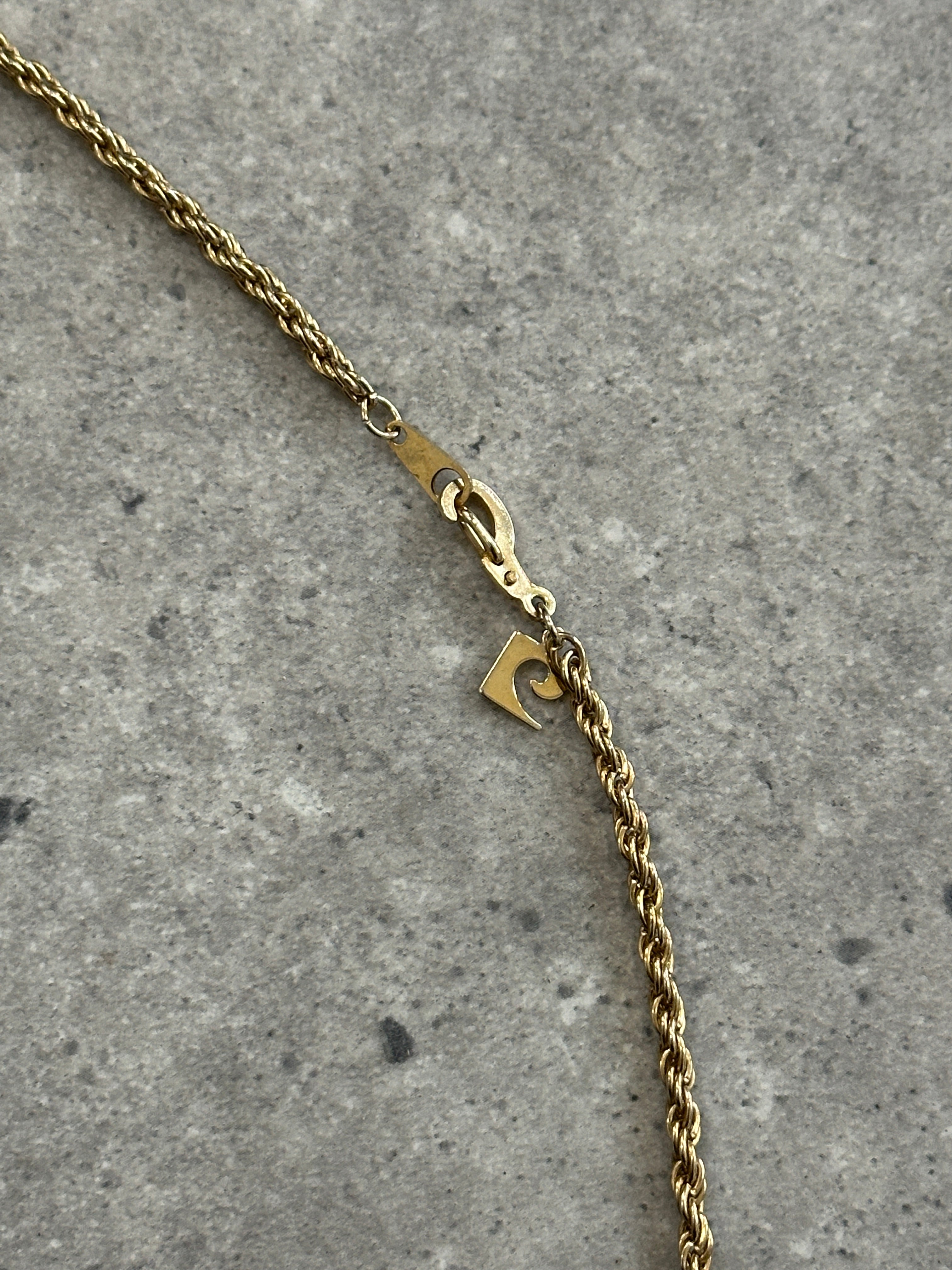 Gold plated Pierre Cardin necklace with a sleek chain design, showcased against a neutral background.