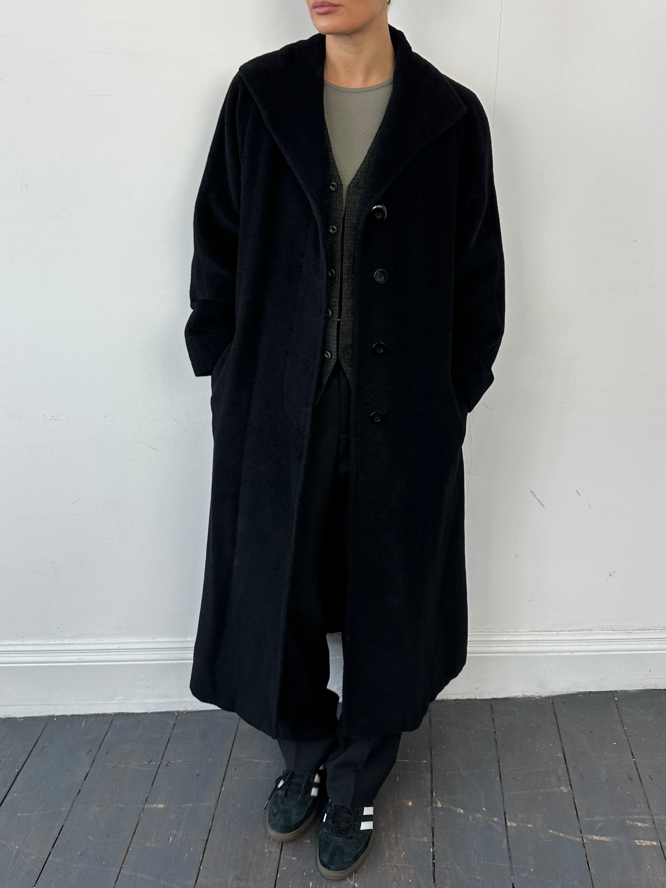 Vintage wool alpaca single-breasted floor-length coat with wide lapels and tailored fit, displayed on a hanger.