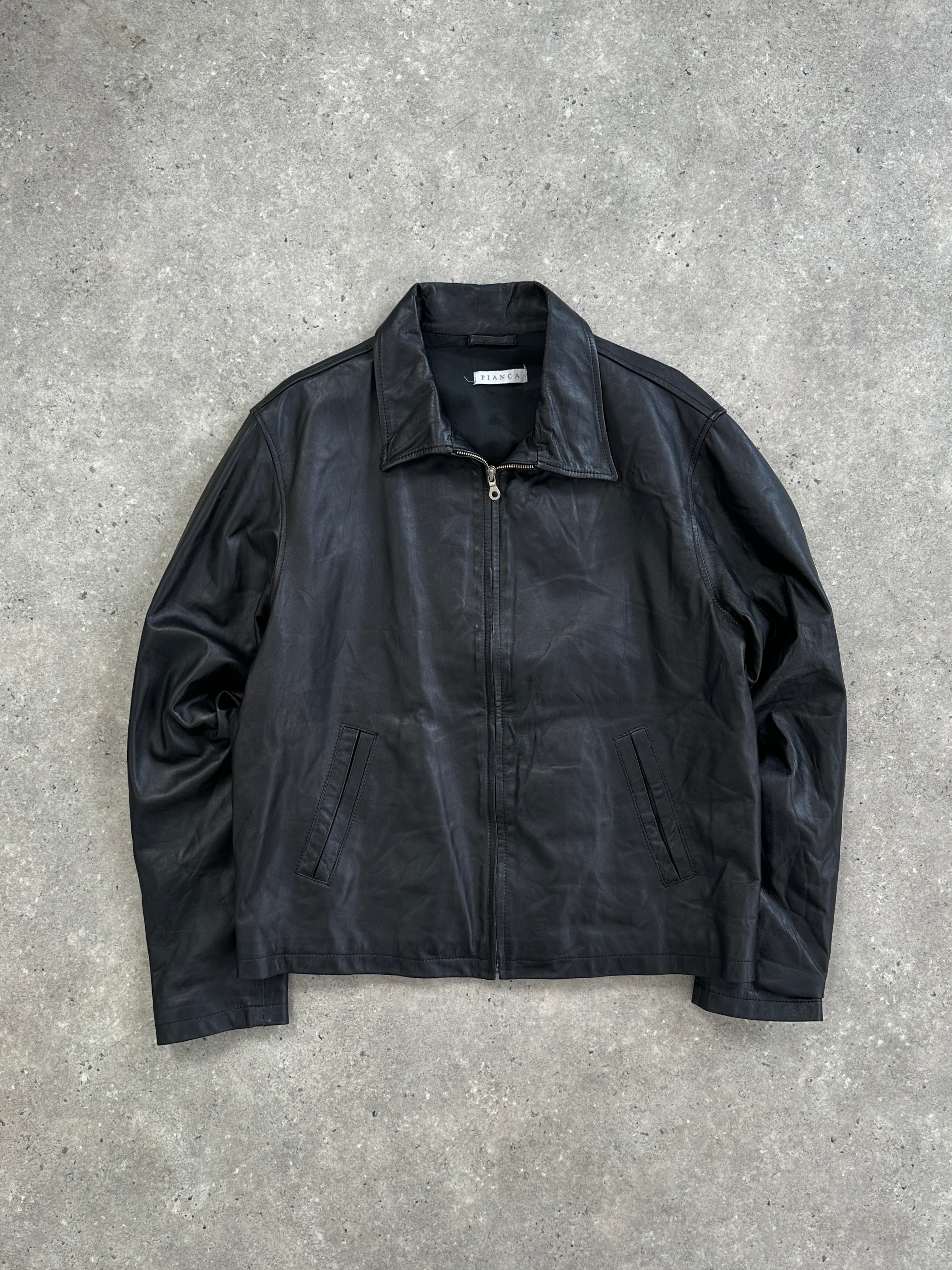 Vintage Italian vintage minimal zip-up leather jacket in size L, featuring a sleek design and classic leather texture.