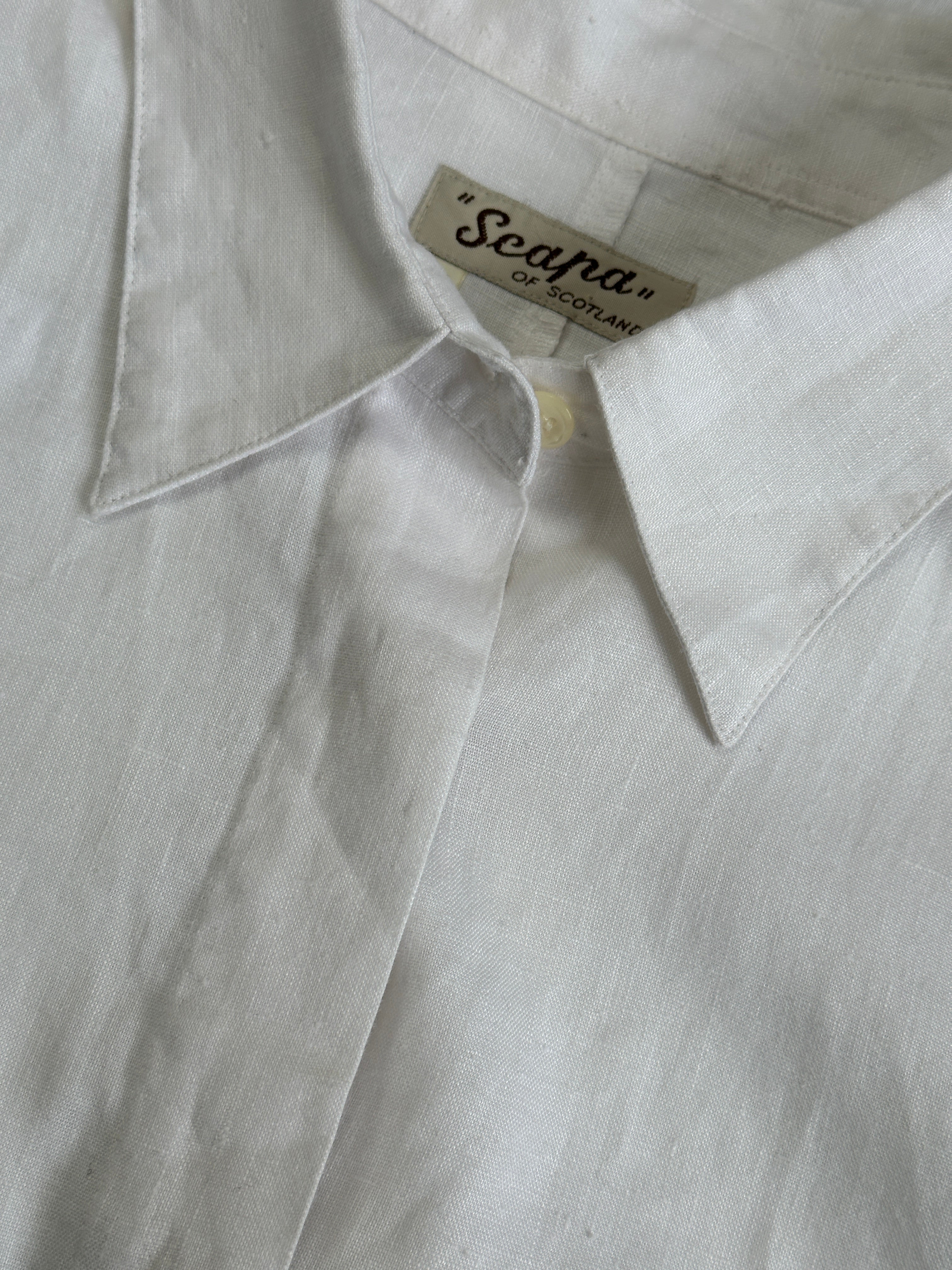 Vintage pure linen concealed placket shirt in size M, displayed flat with detailed fabric and classic collar.
