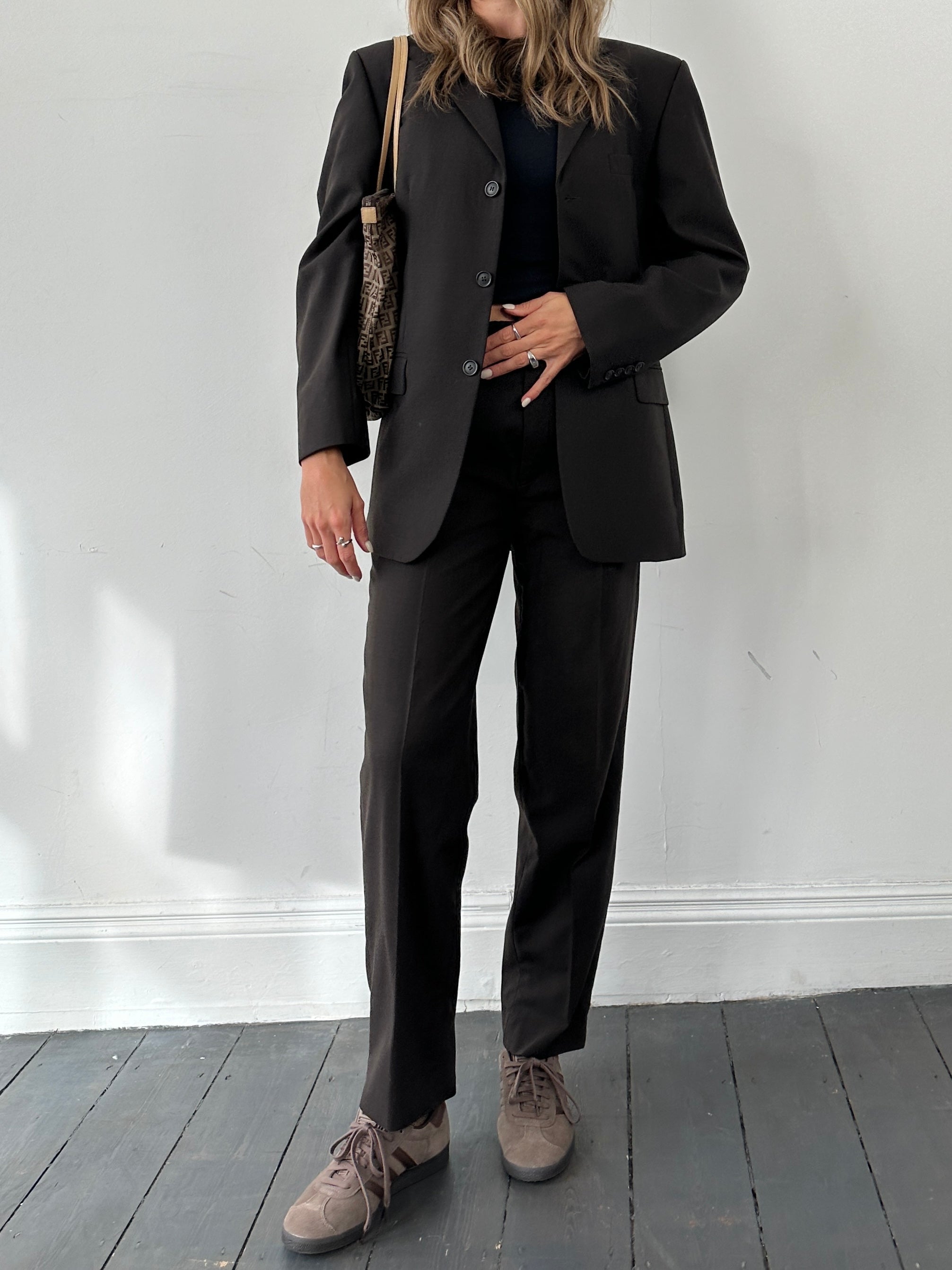 Vintage wool single-breasted jumpsuit in size 38R/W28, featuring classic tailored design and vintage fabric details.