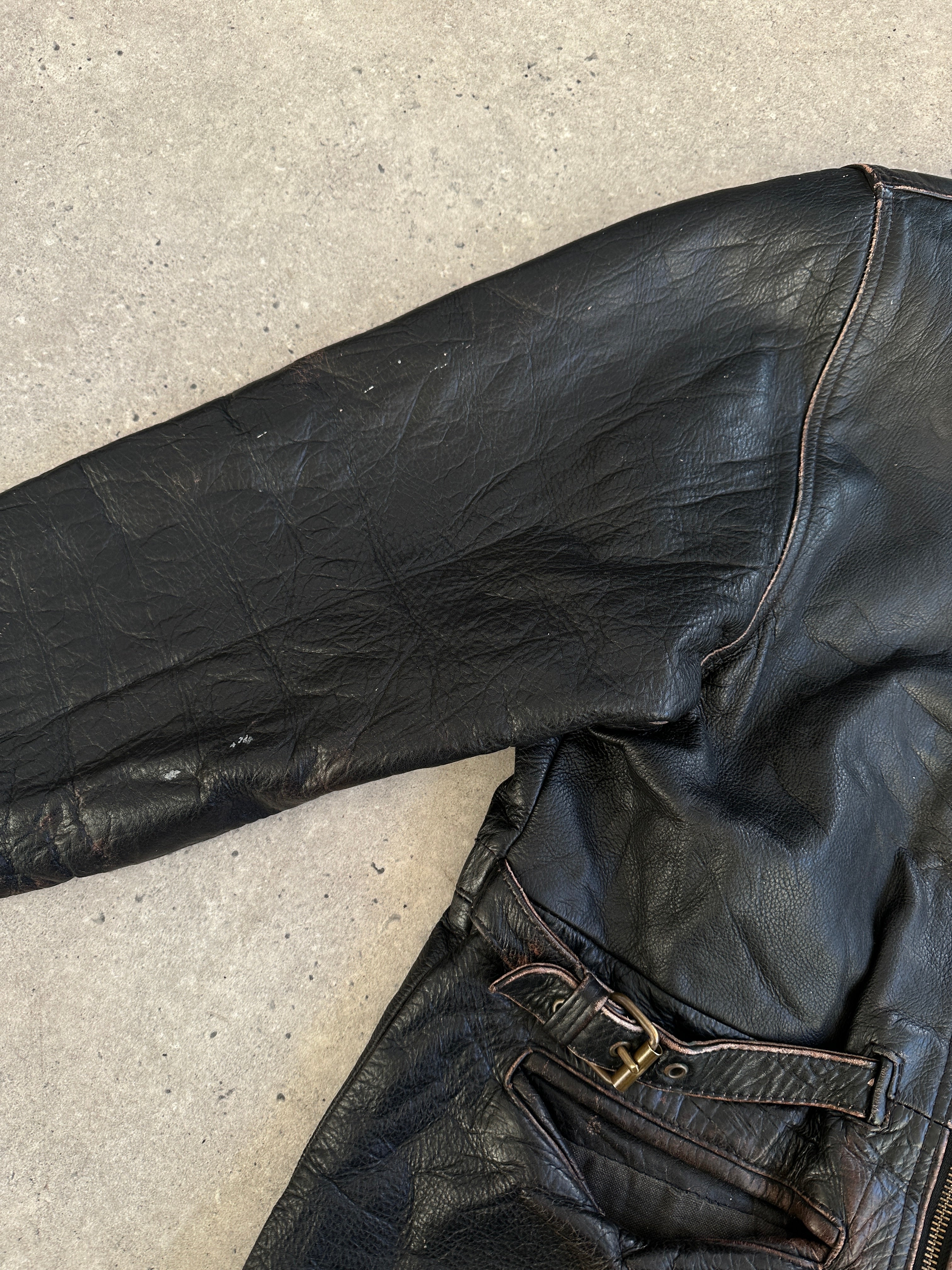 Vintage distressed leather jacket in XL size, featuring rugged texture and classic style, by Vintage.
