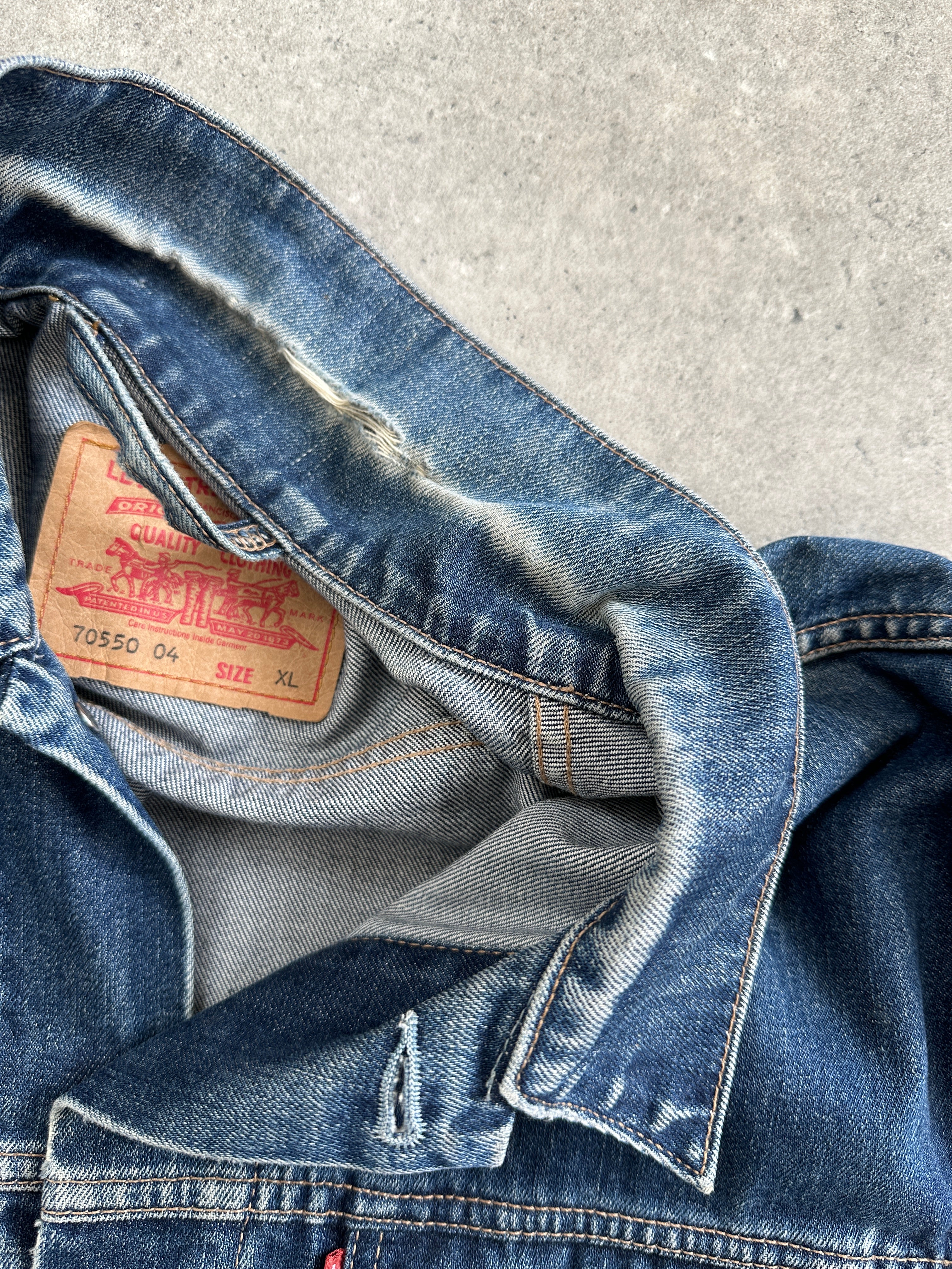 Levi's 1990s mid wash denim jacket in XL, showing classic style with button-front and traditional denim texture.