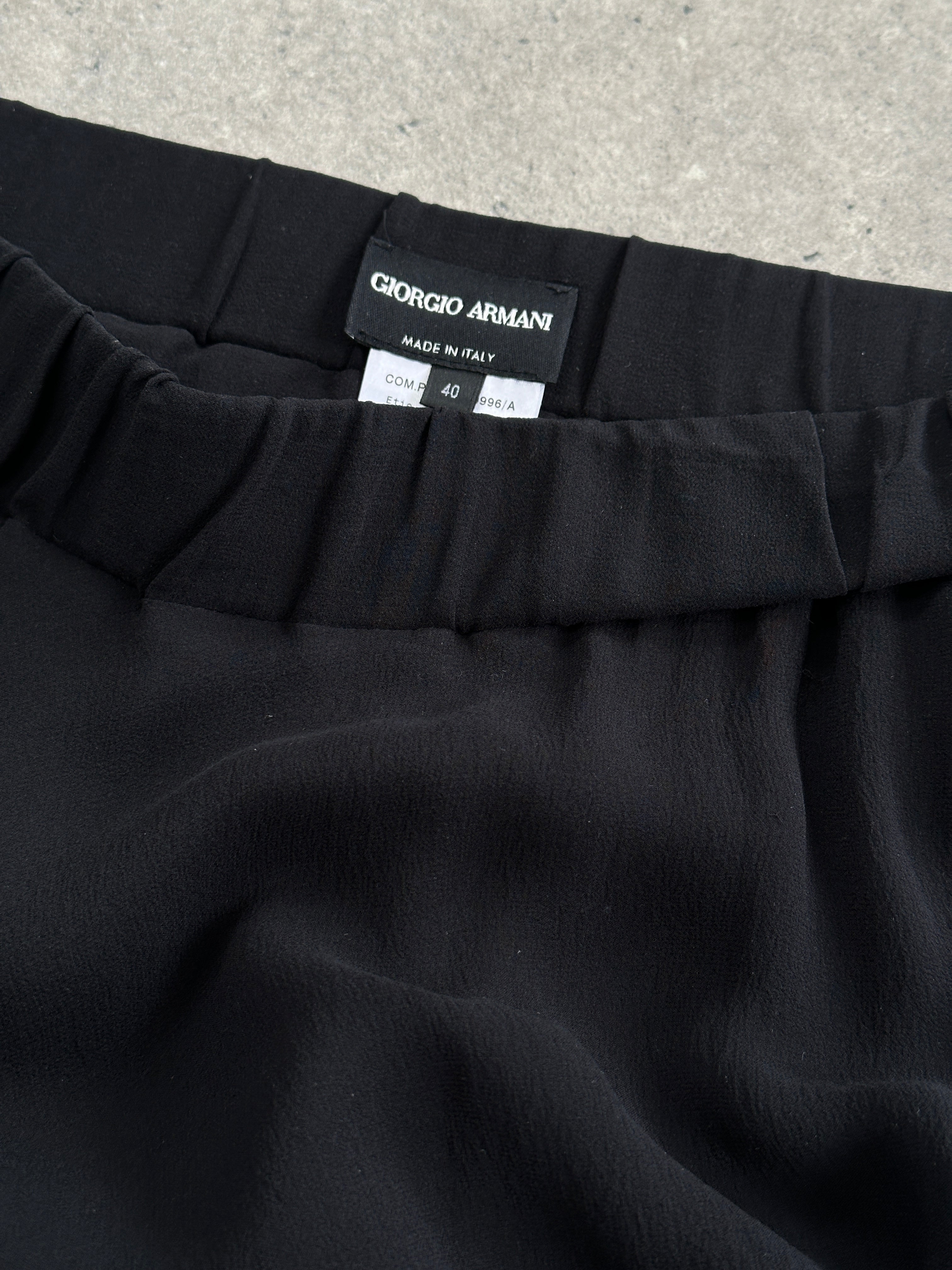 Giorgio Armani pure silk layered skirt in size 28-32W, showcasing elegant, flowing fabric and stylish design.