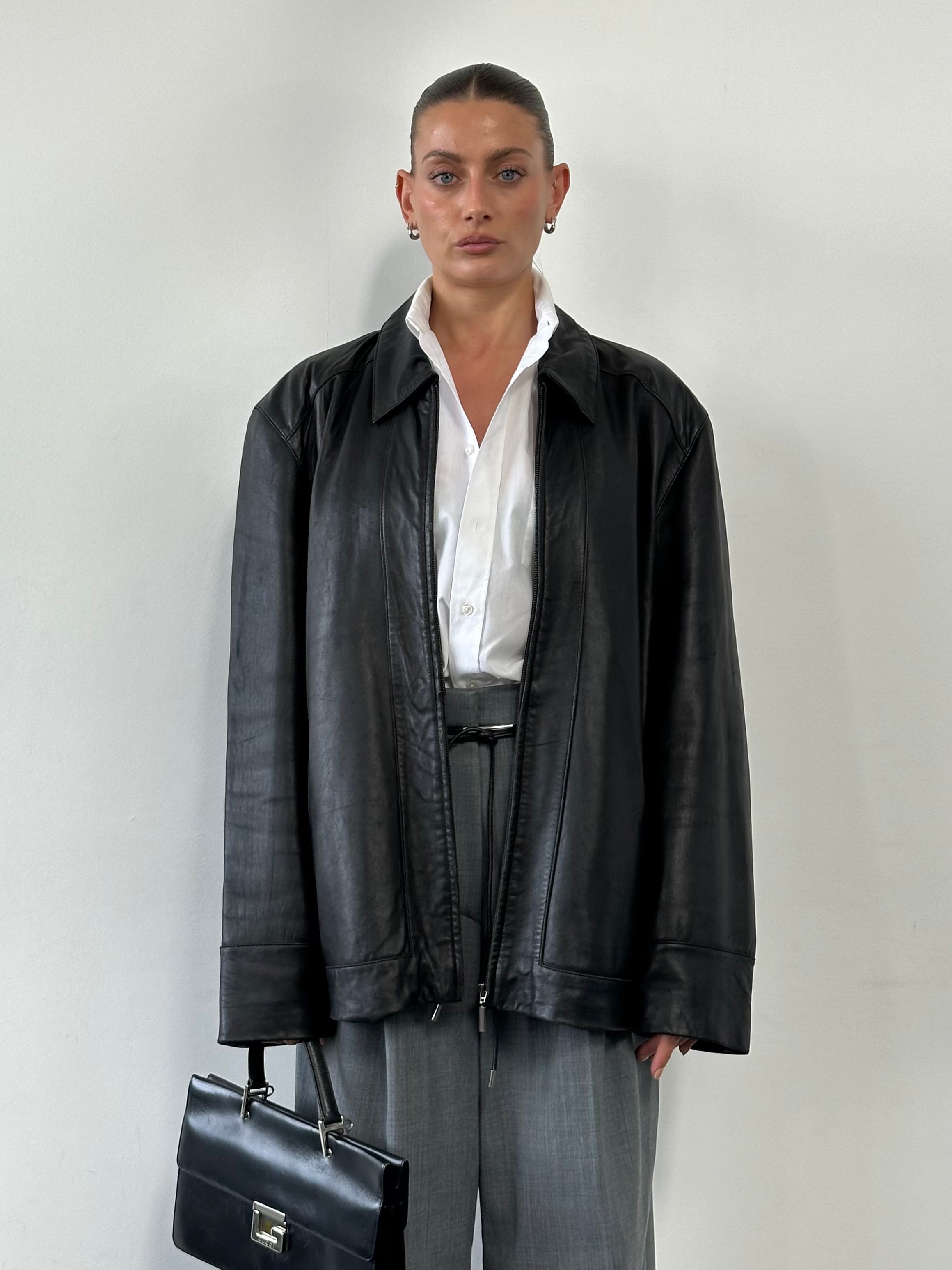 Balmain smooth leather jacket in XL size, featuring a sleek design with a classic collar and zip front, showcased on a hanger.