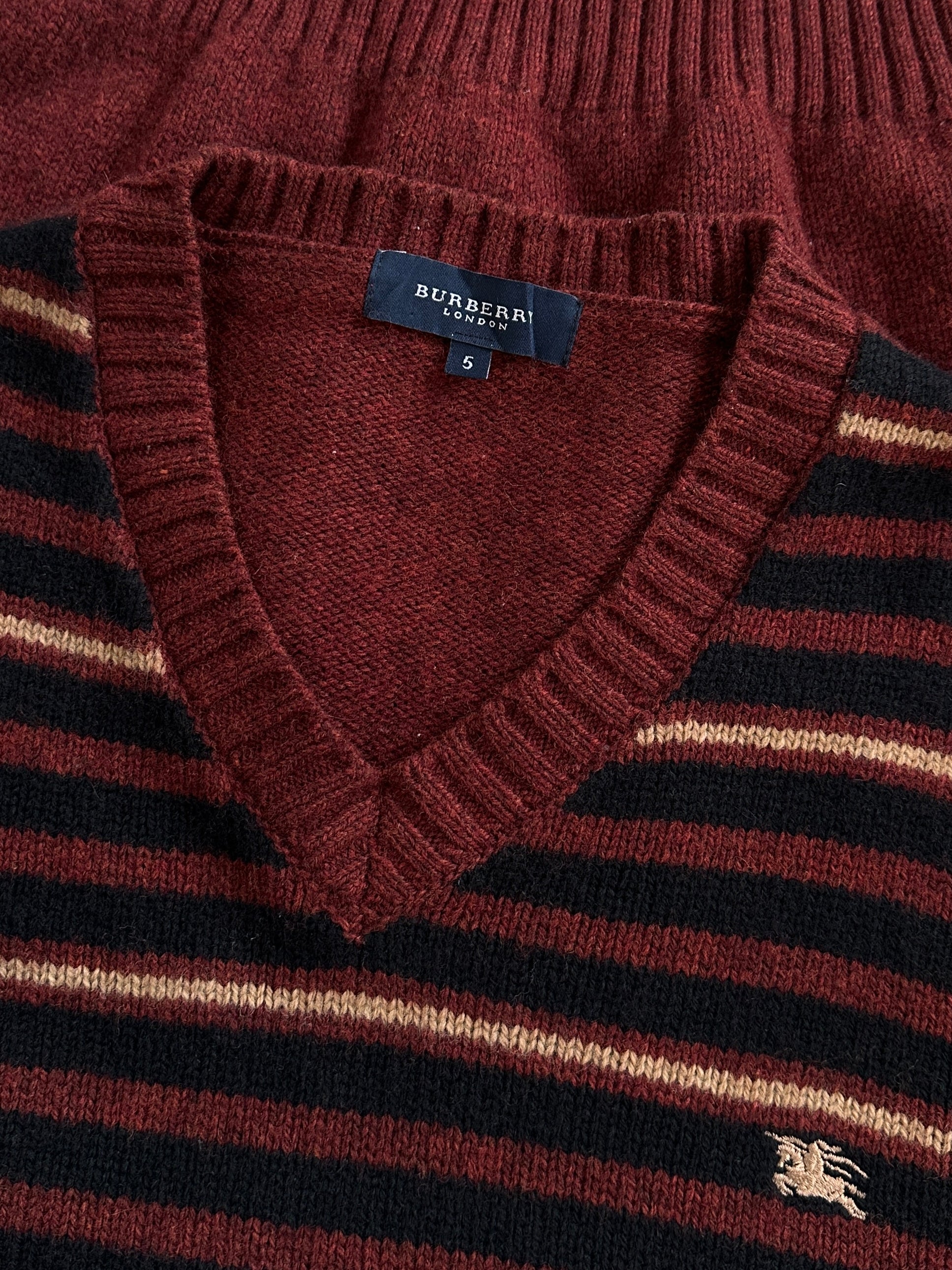 Burberry London 2000s lambswool V-neck striped jumper in size M/L, featuring classic design and bold pattern.
