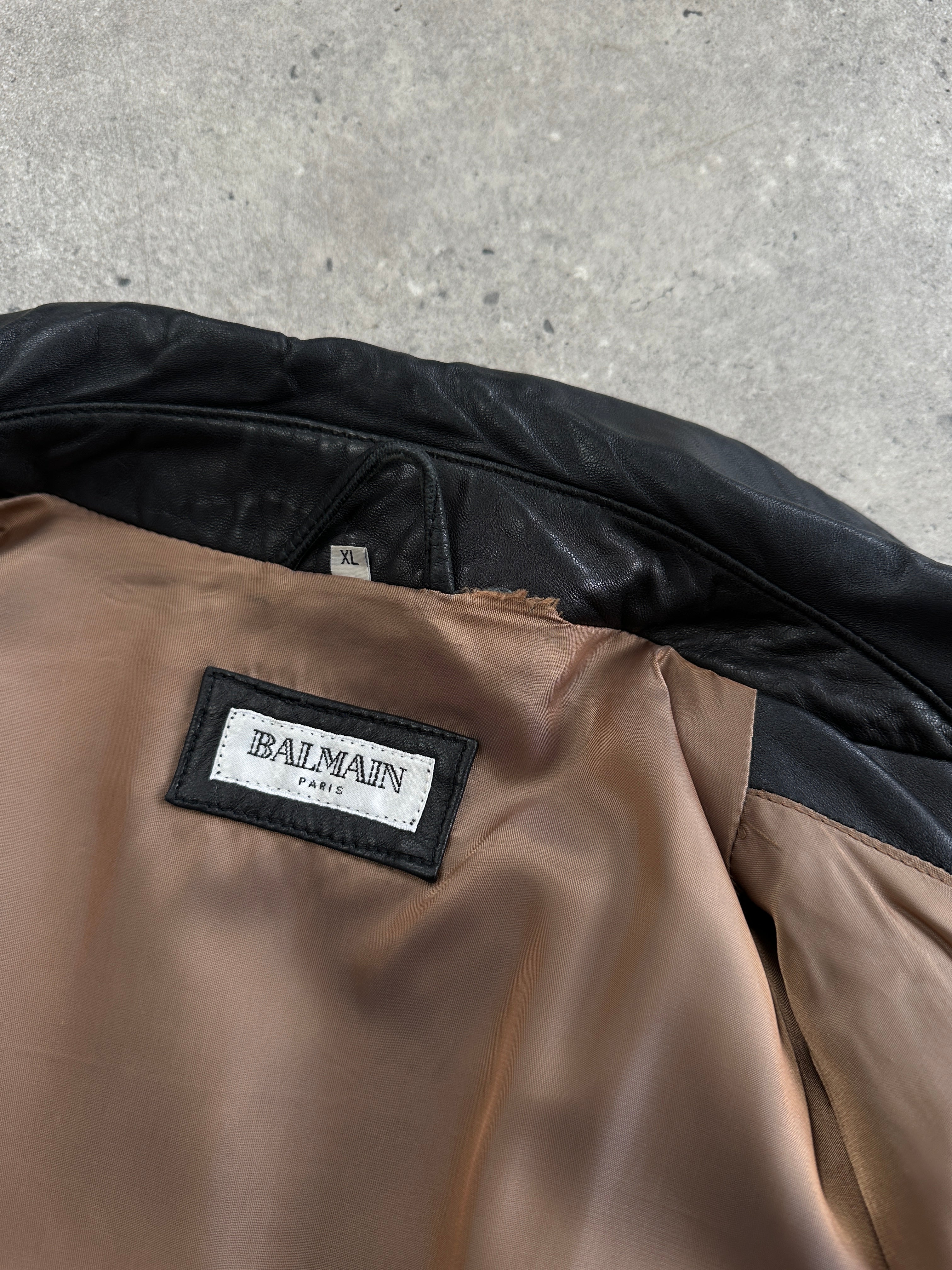 Balmain smooth leather jacket in XL size with sleek black design, featuring classic collar and zip closure.