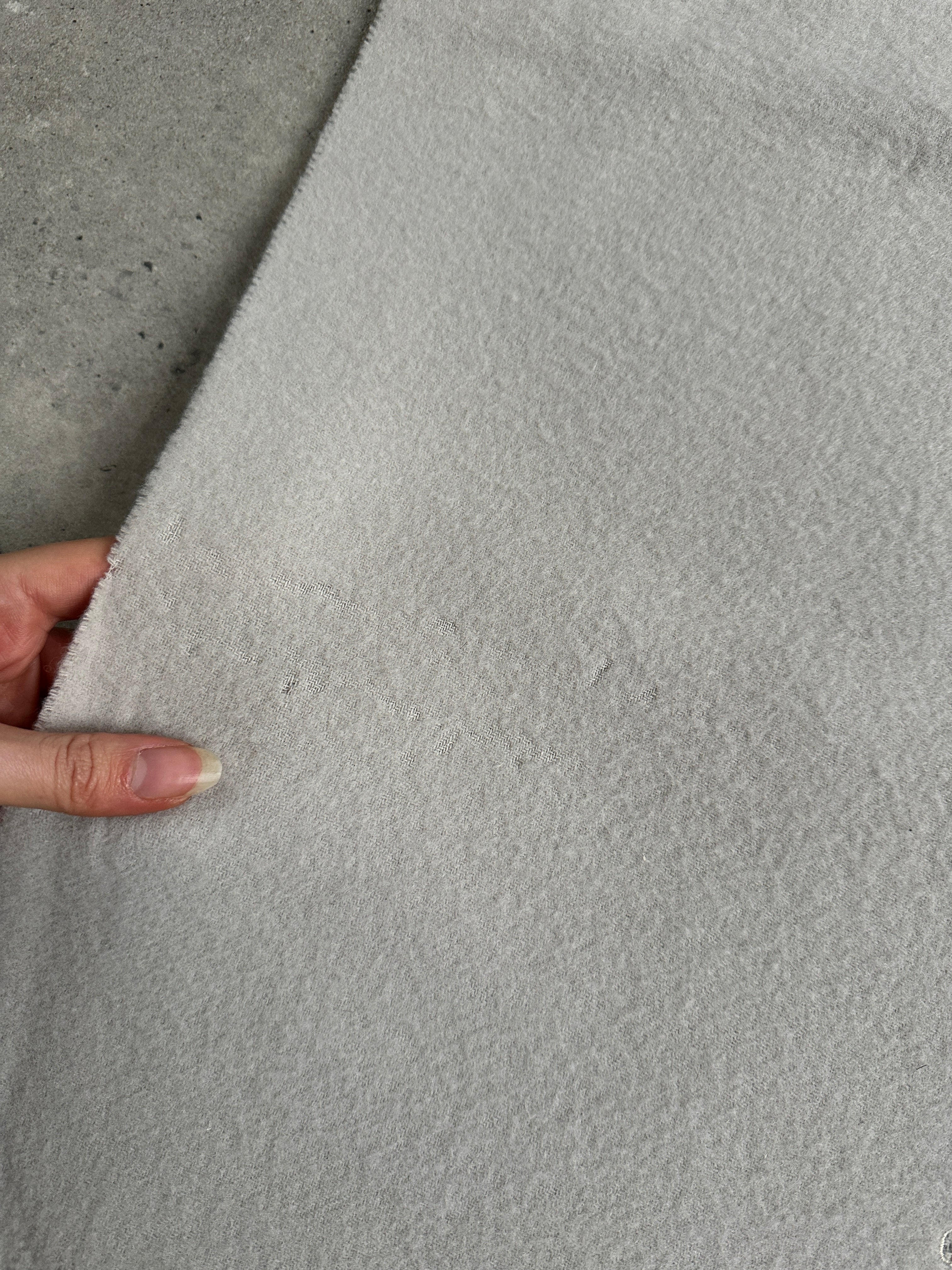 Giorgio Armani Le Collezioni 2000s pure wool logo scarf with subtle Armani branding and classic design, displayed on a neutral background.