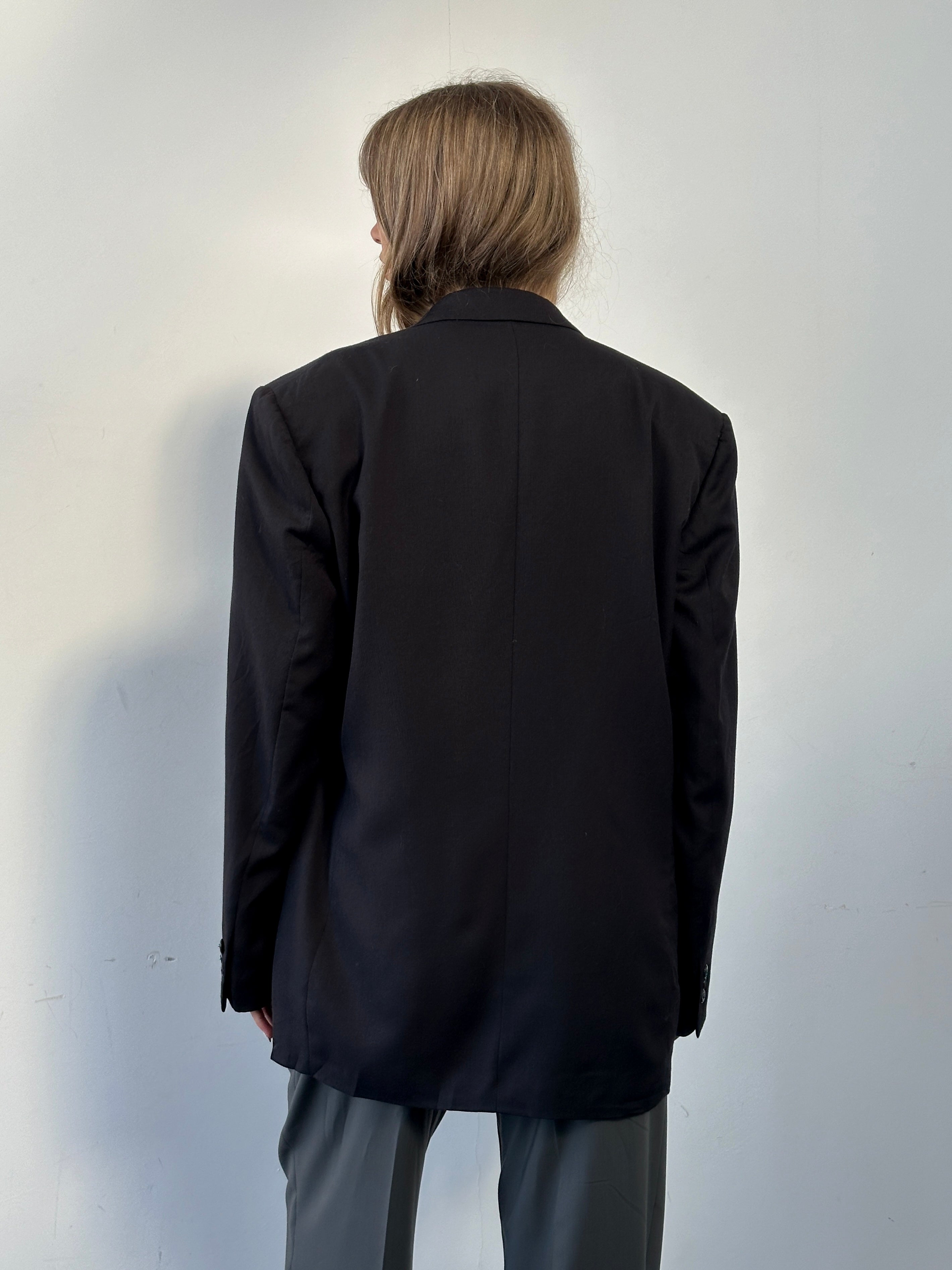 Vintage wool double-breasted blazer in size 40L, featuring classic cut and tailored fit, displayed on a neutral background.