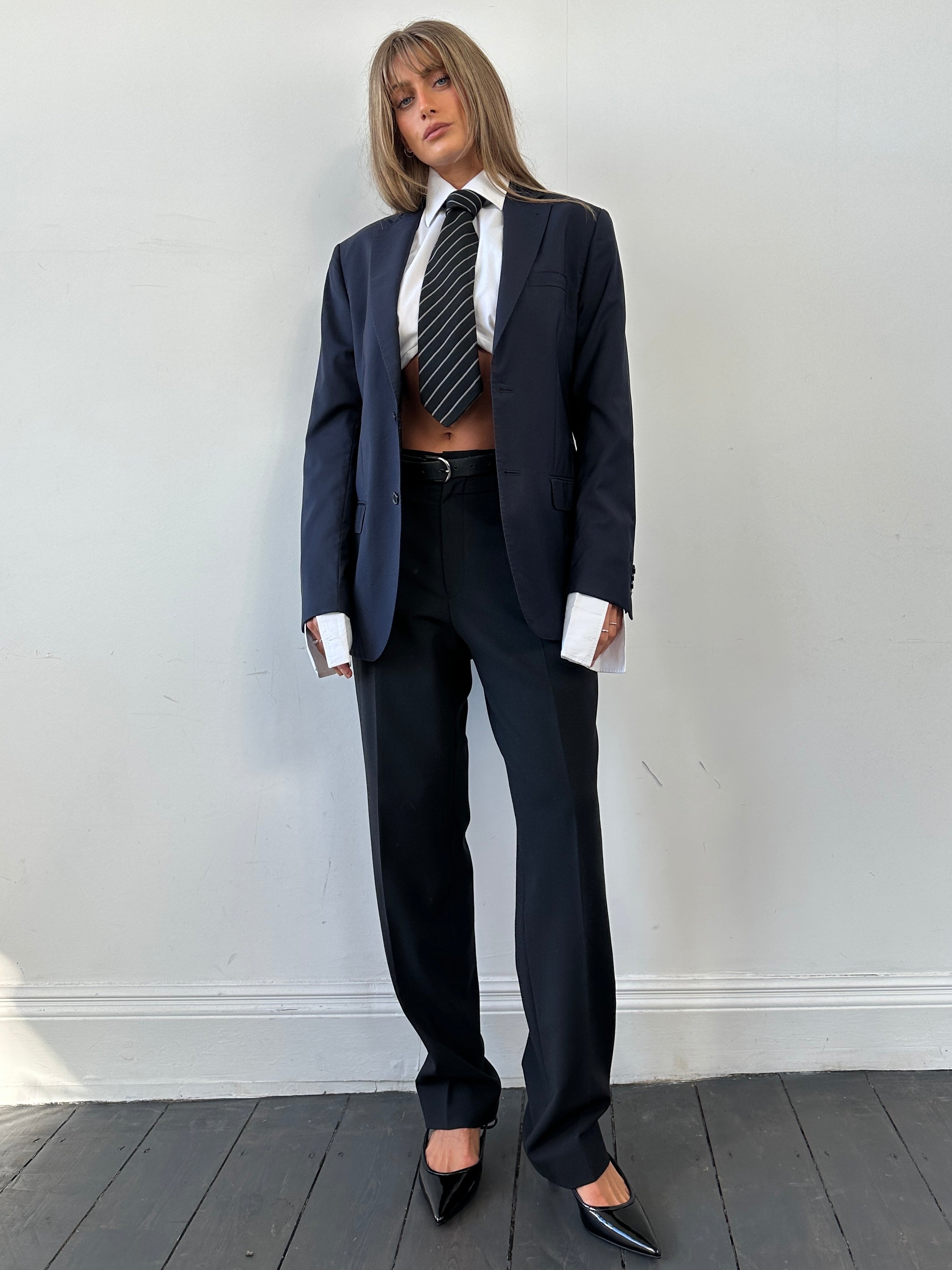 Valentino wool single-breasted blazer in classic design, size 40/M, displayed on a hanger with neutral background.