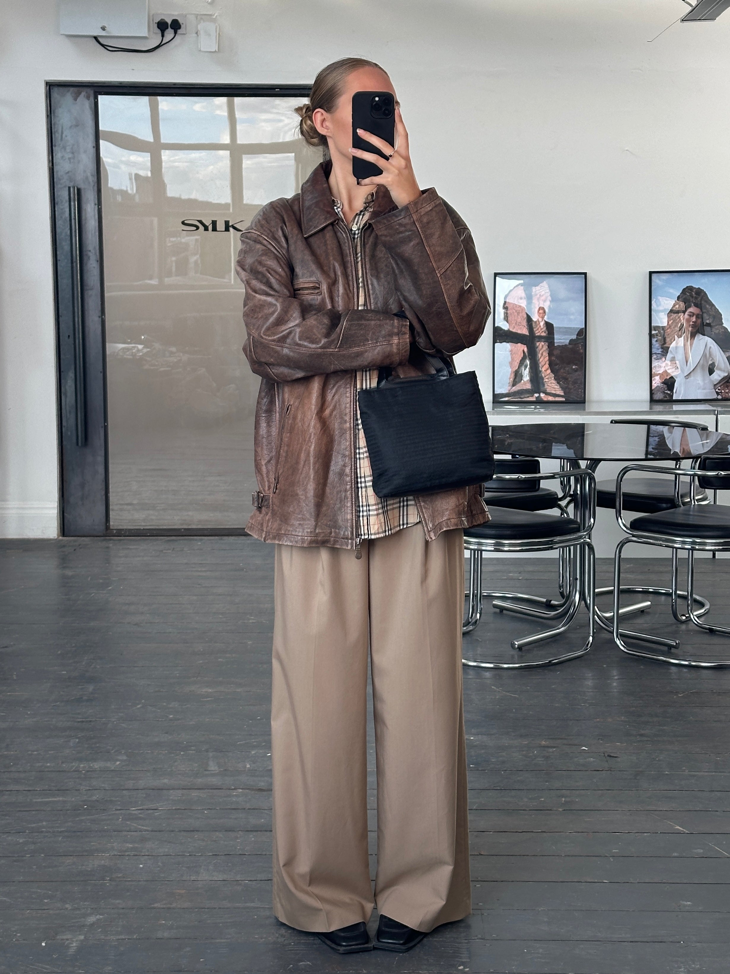 Vintage 1990s aged leather jacket in size XL, showcasing classic style and distressed leather finish.