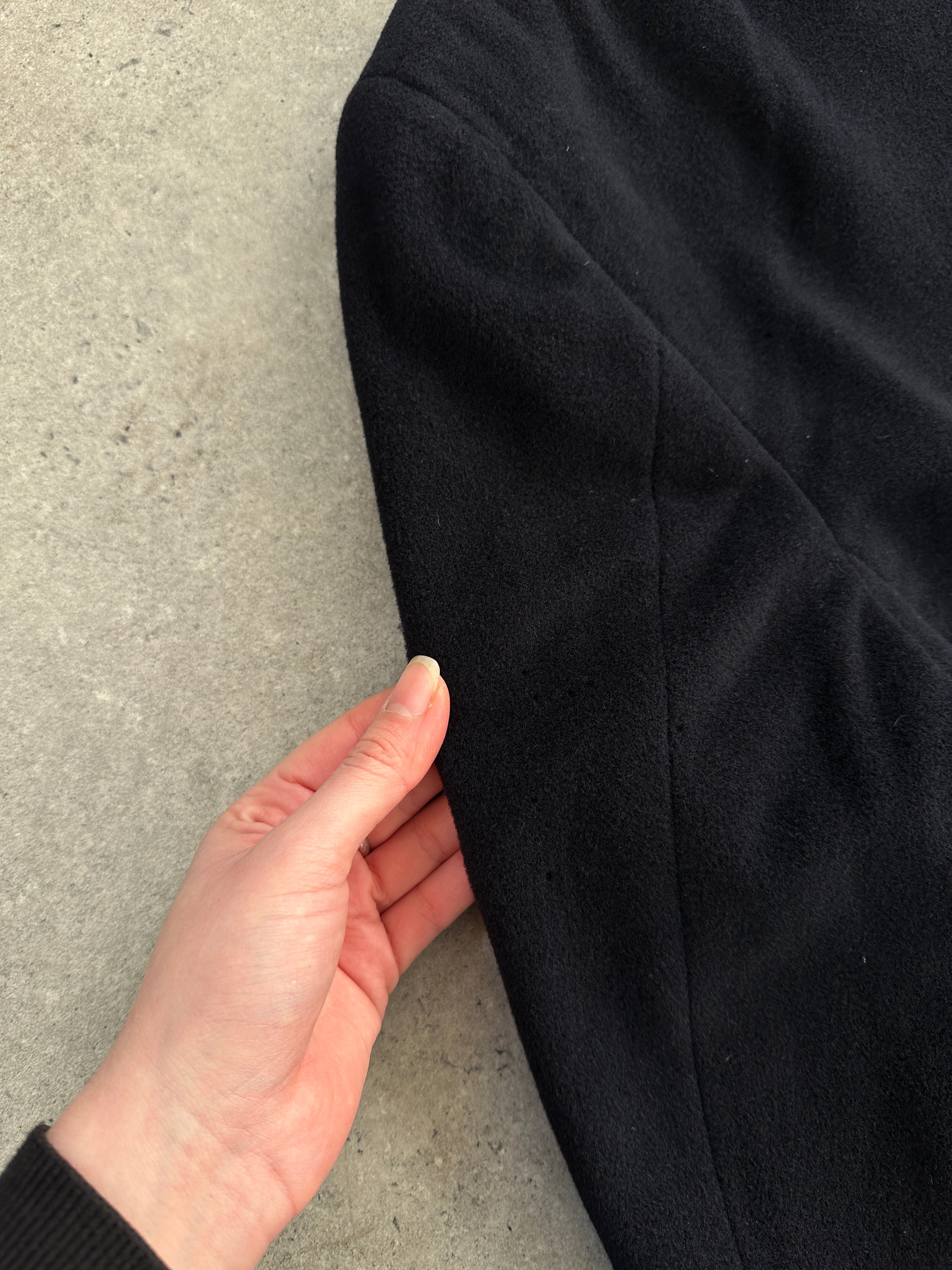 Giorgio Armani Le Collezioni men's XXL pure wool single-breasted coat hanging on a hanger, showcasing its classic design and tailored fit.