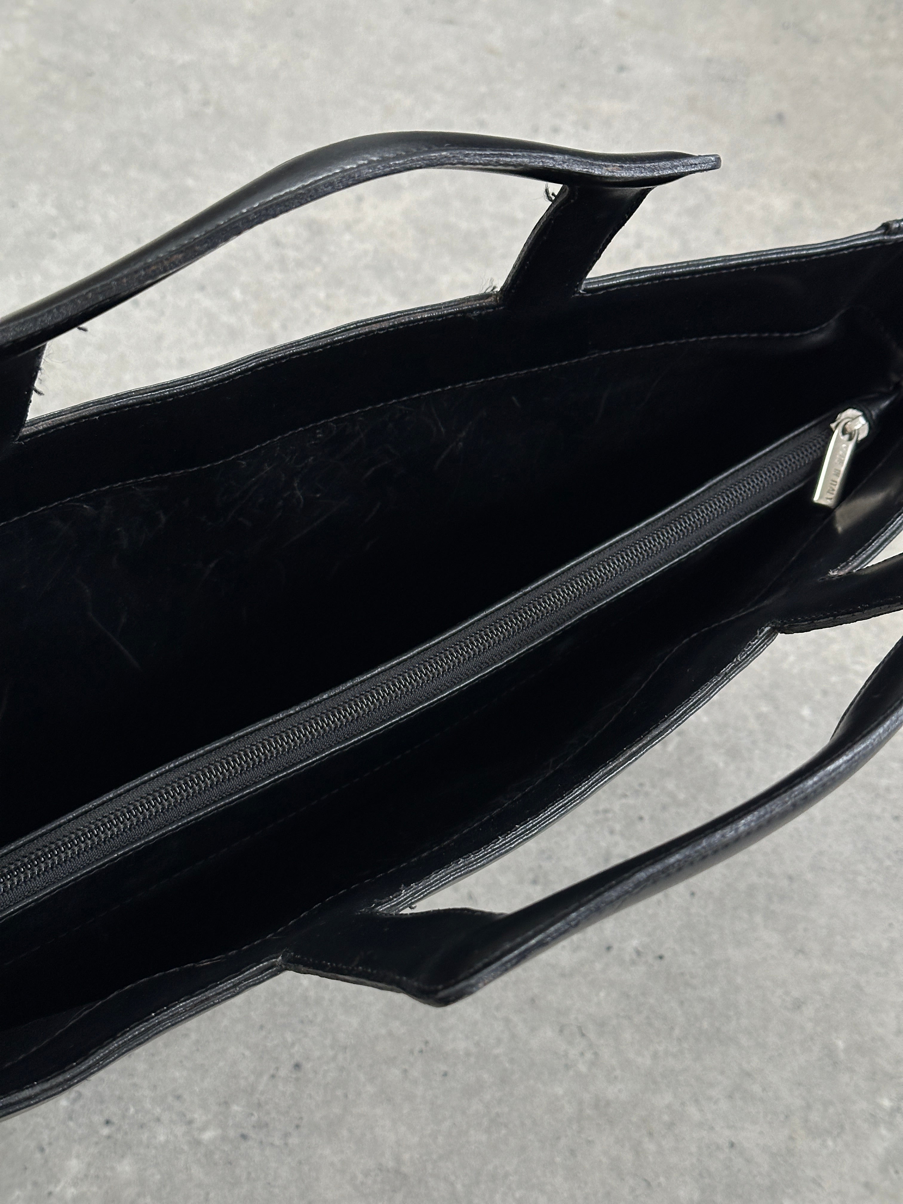 Vintage Italian leather briefcase bag with sturdy handles and classic design, perfect for professional or travel use.