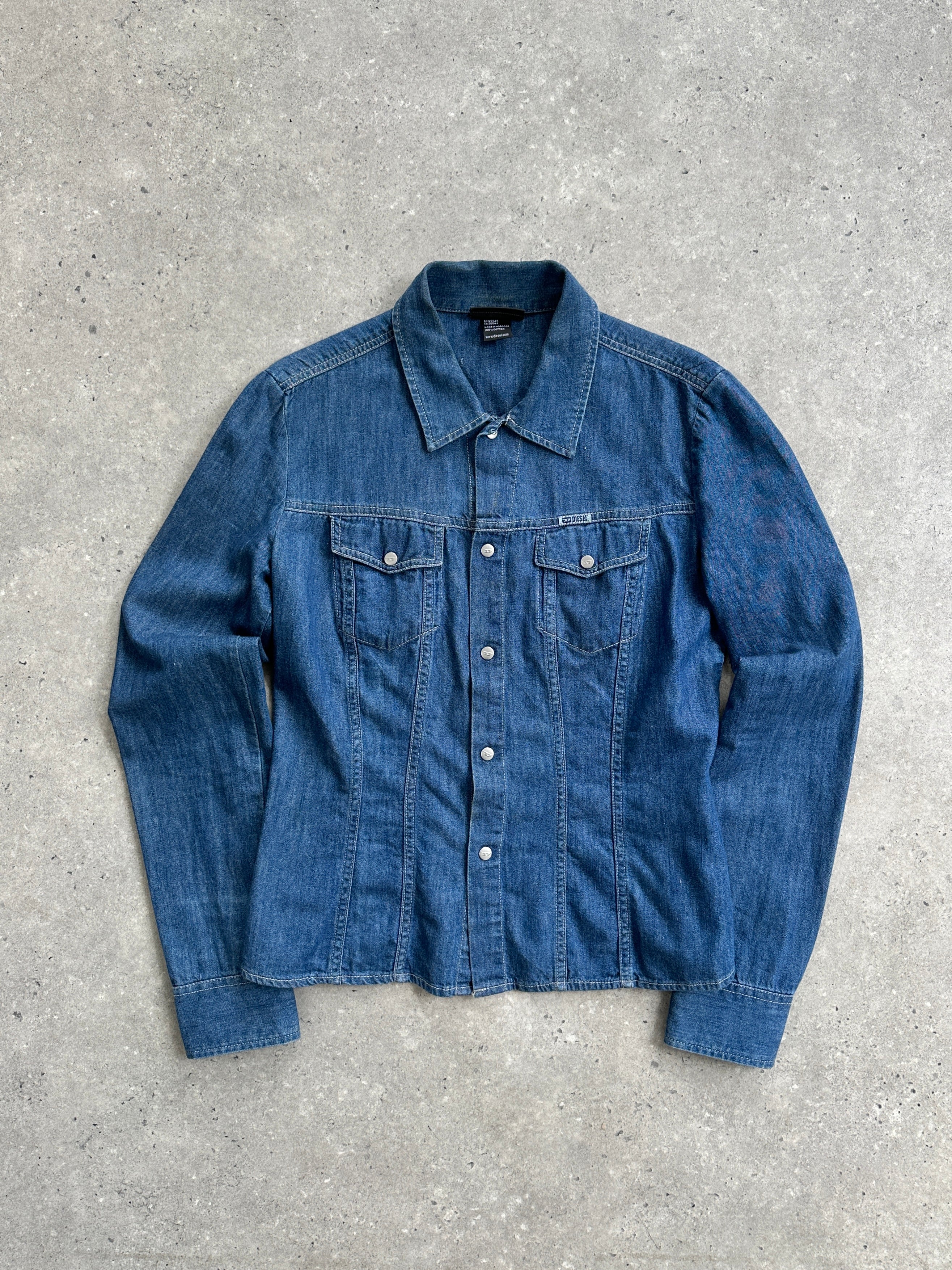 Diesel fitted denim shirt in size S, showing classic blue denim fabric, button front, and collar detail.