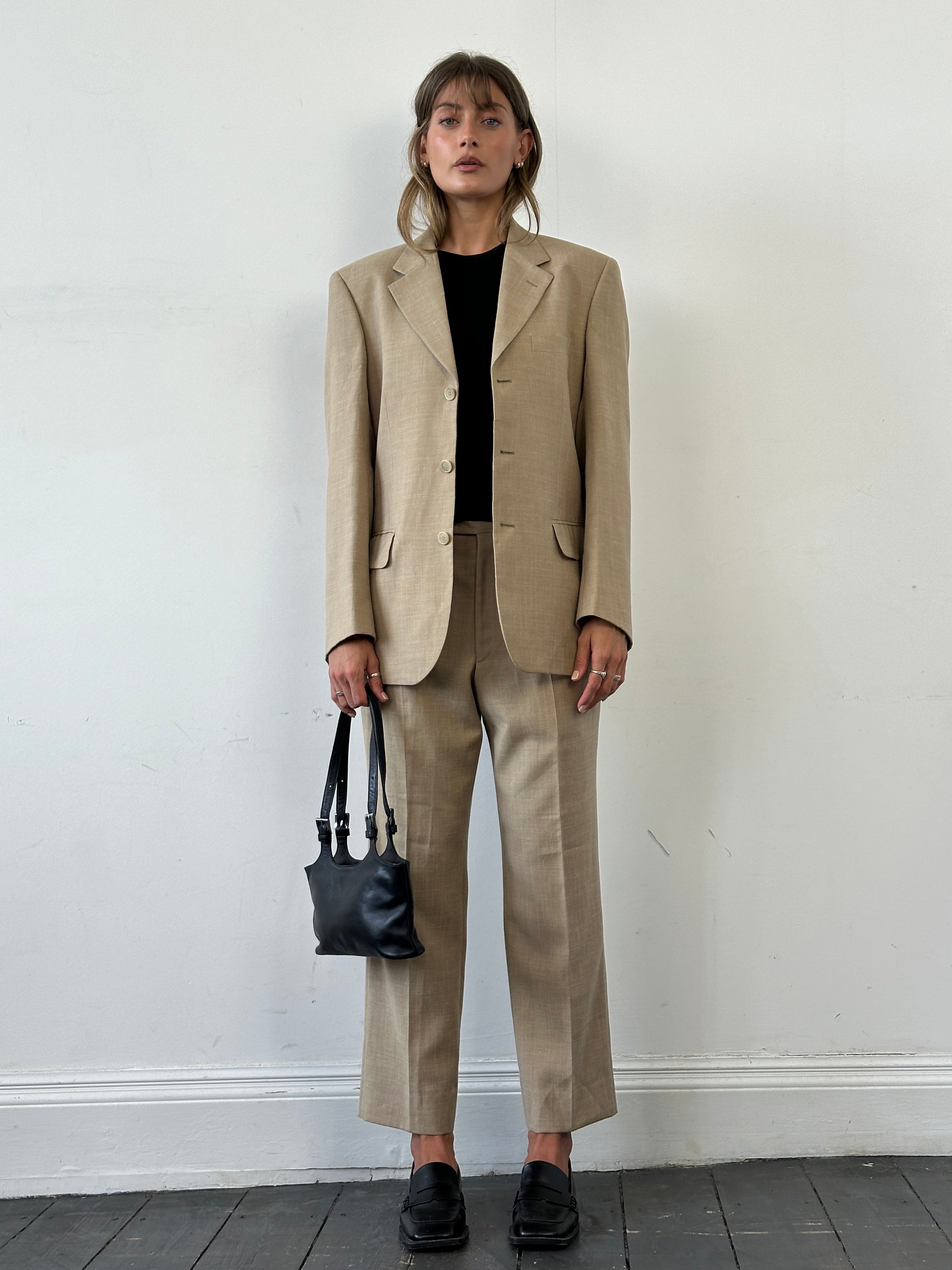 Vintage single-breasted wool linen blend suit jumpsuit in size 36R/W31, featuring classic tailored design and distinct fabric texture.