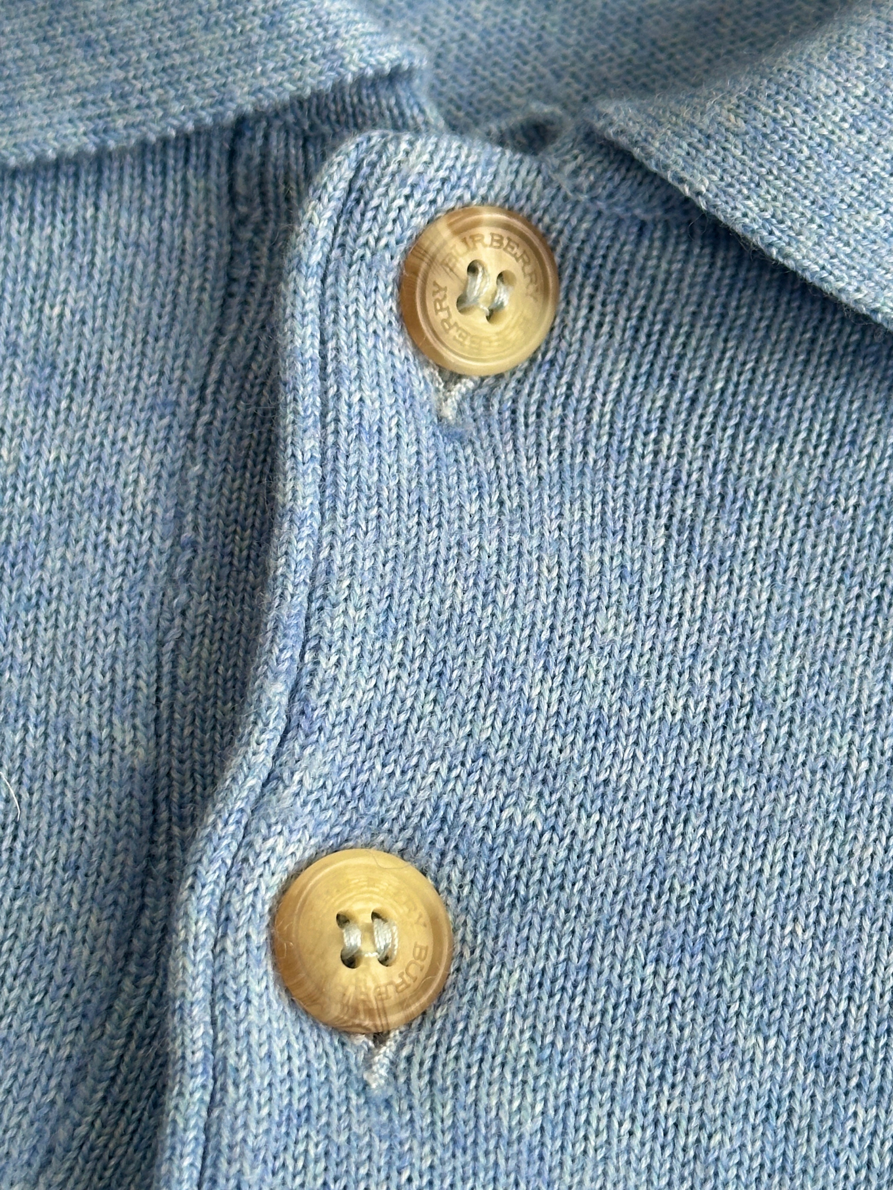 Burberry London 2000s merino wool polo logo jumper in XL, featuring the classic Burberry emblem and a cozy knit texture.