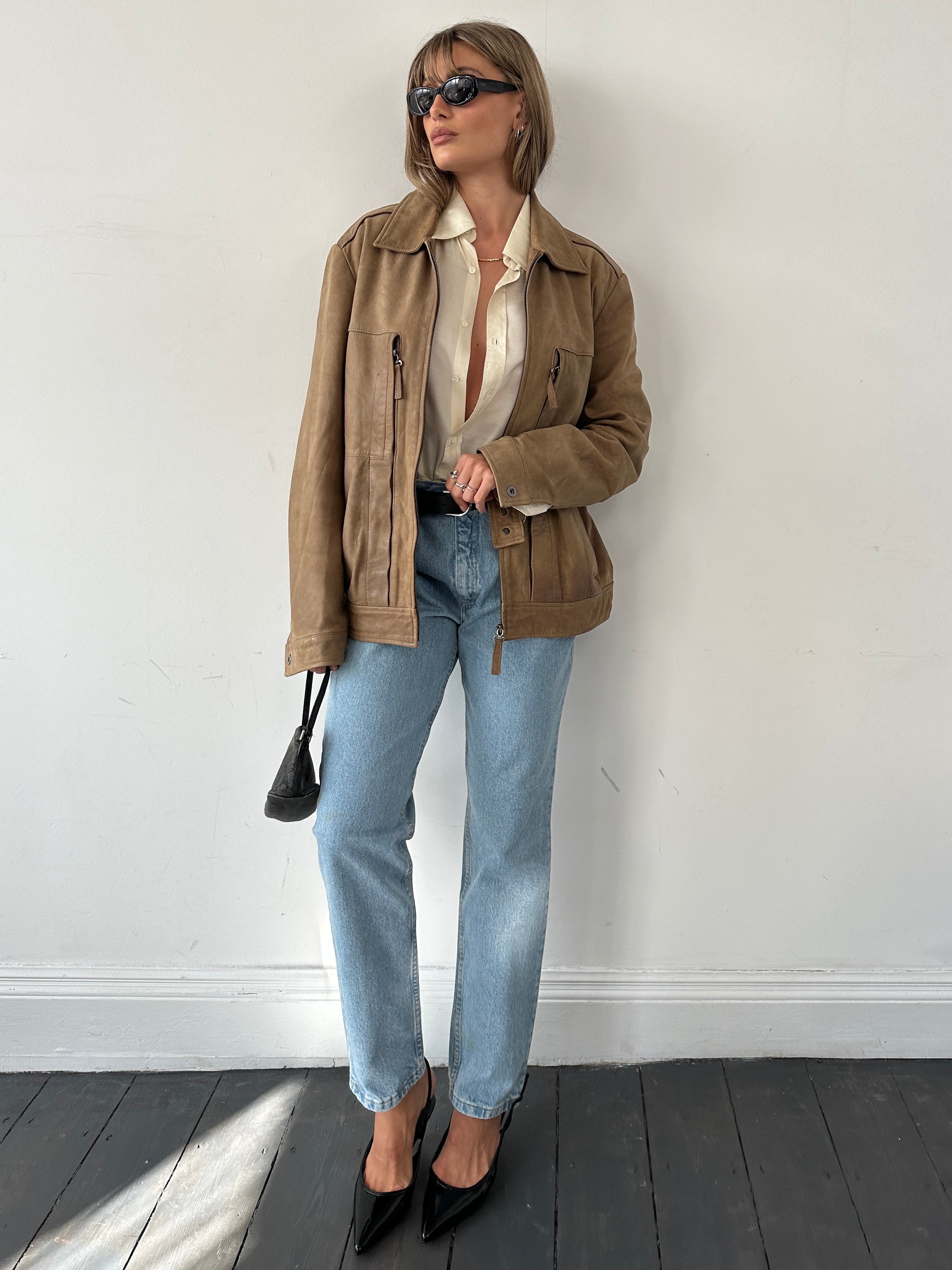 Light wash Lee high waisted denim jeans with W30 fit, showcasing classic five-pocket design and relaxed fit.