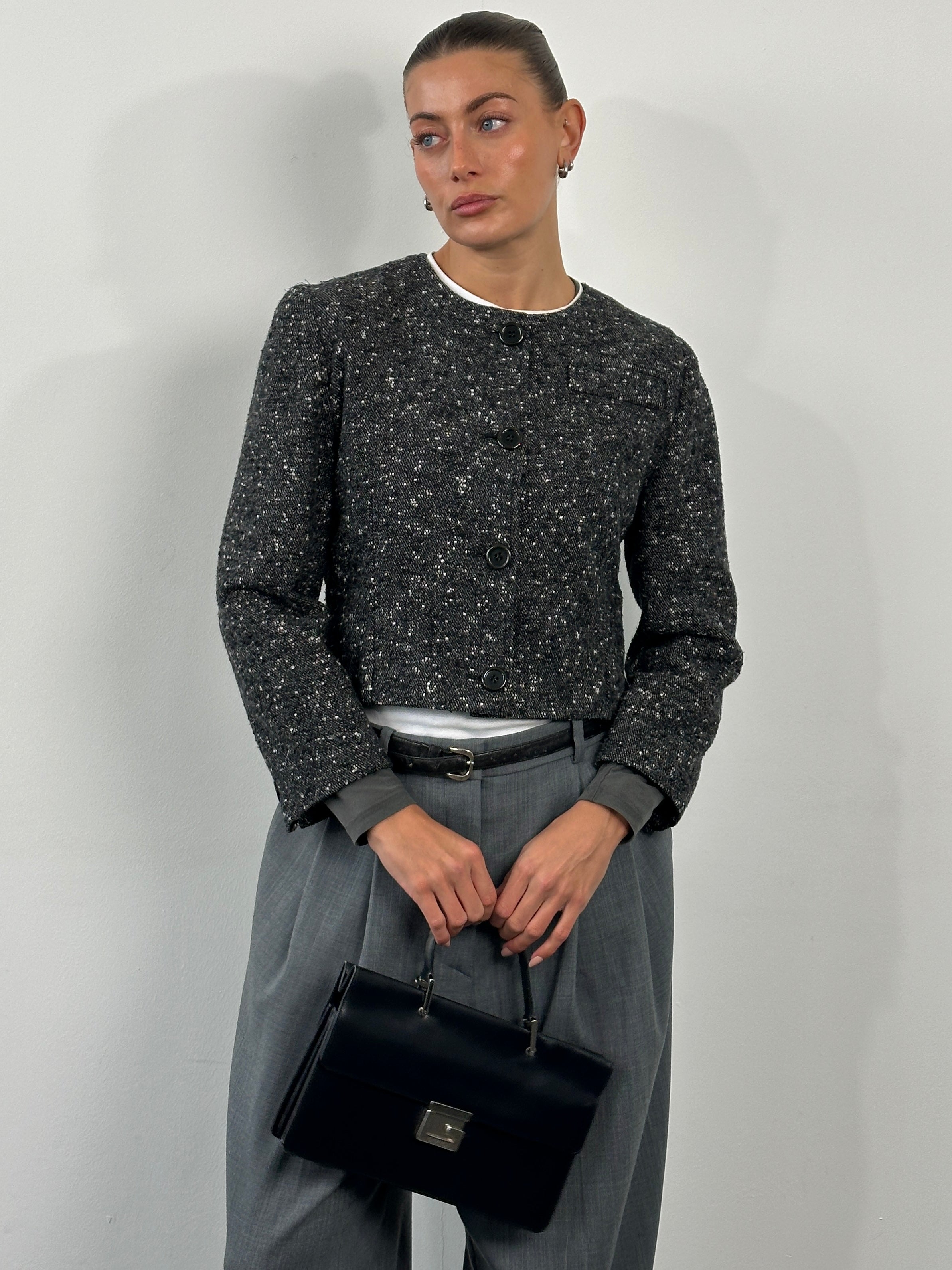 Italian vintage 1990s pure wool tailored jacket in size S/M, featuring classic design and detailed craftsmanship.