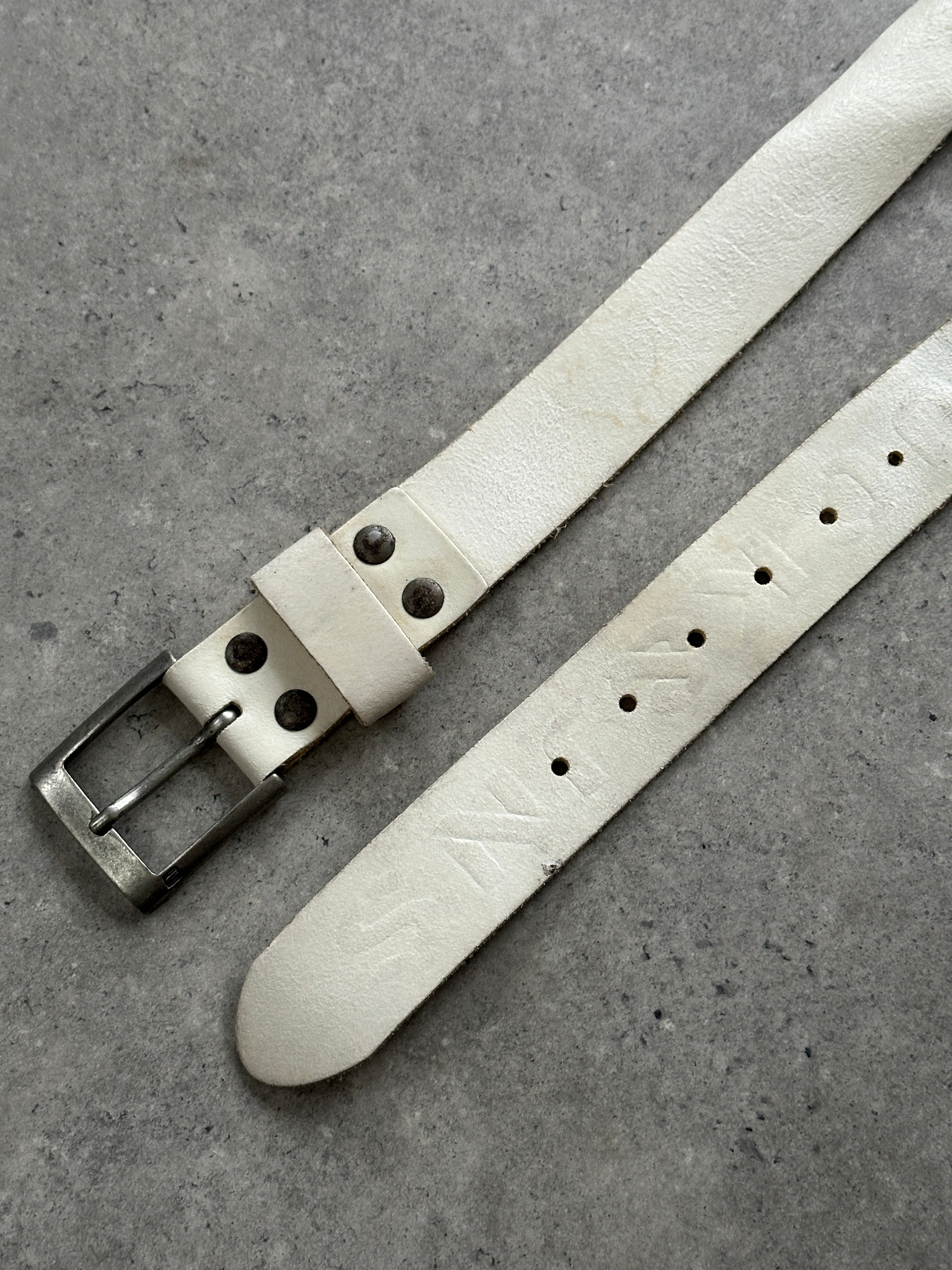 Vintage distressed leather belt in W36-40, showcasing rugged texture and aged finish on a classic men's accessory.