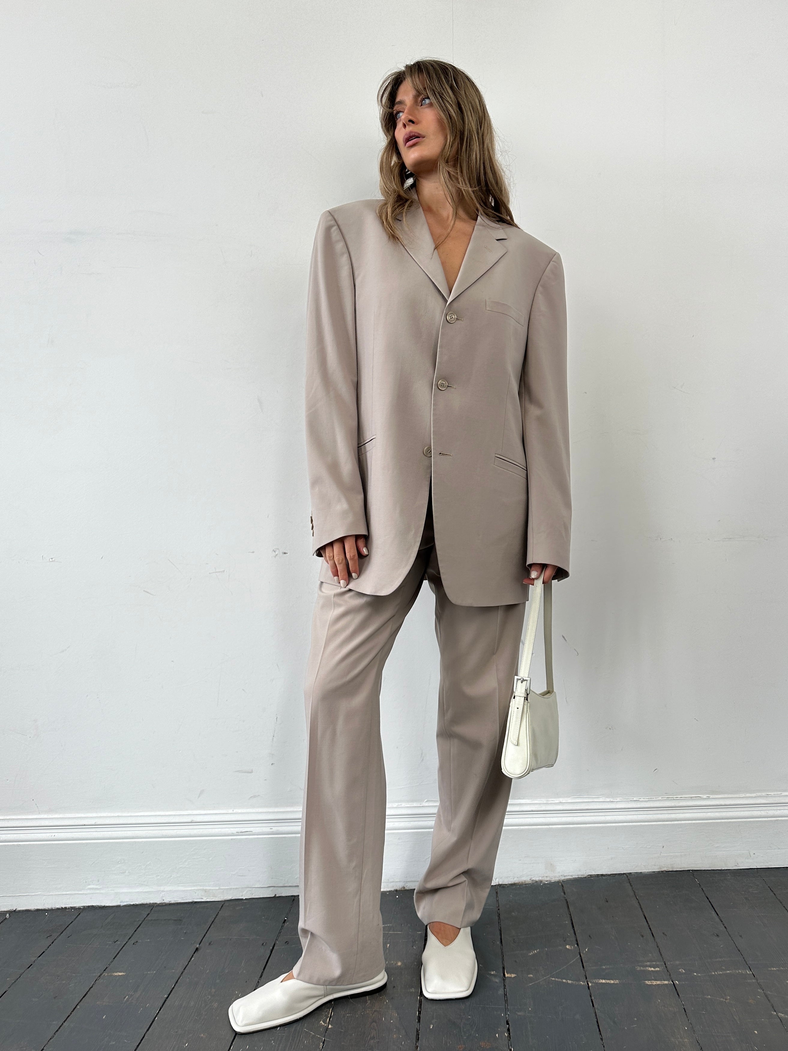 Versace single-breasted wool jumpsuit in size 42R/W30, featuring tailored fit and elegant design, front view.