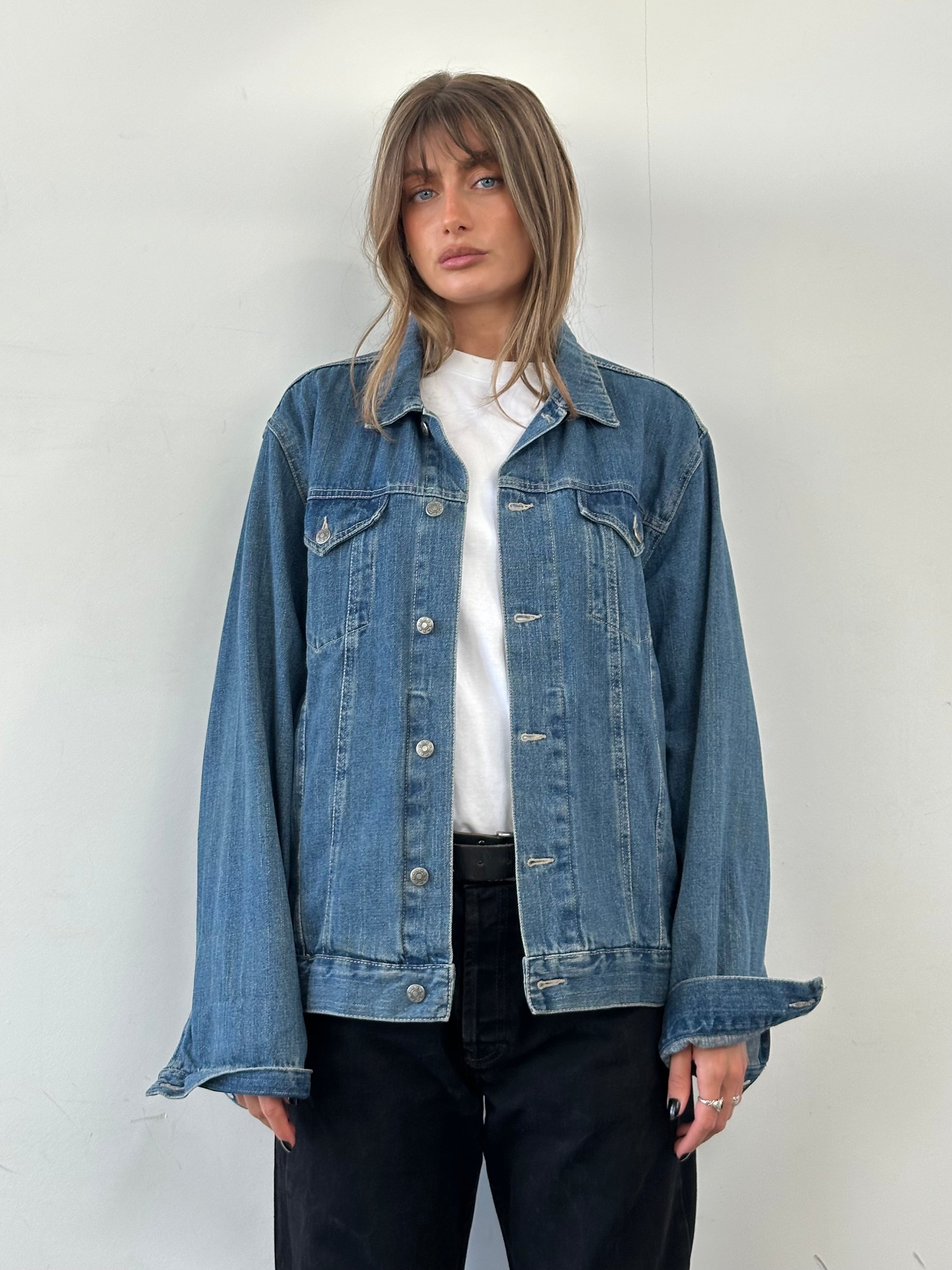 Vintage pure cotton denim jacket in XL size, classic blue color, featuring button closure and chest pockets, casual style.