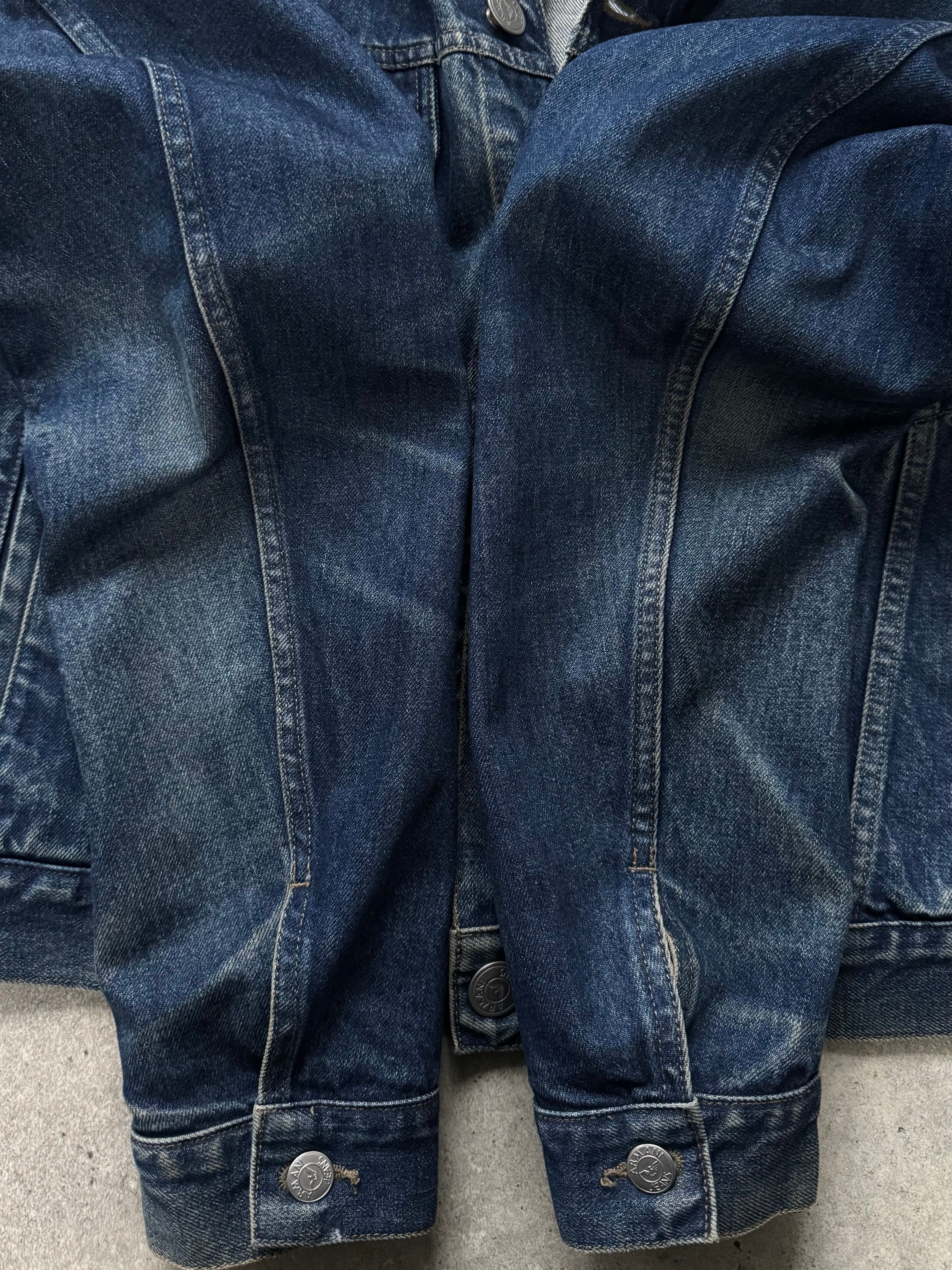 Armani Jeans 1900s mid wash denim jacket, casual style, front view showing classic collar and button closures.