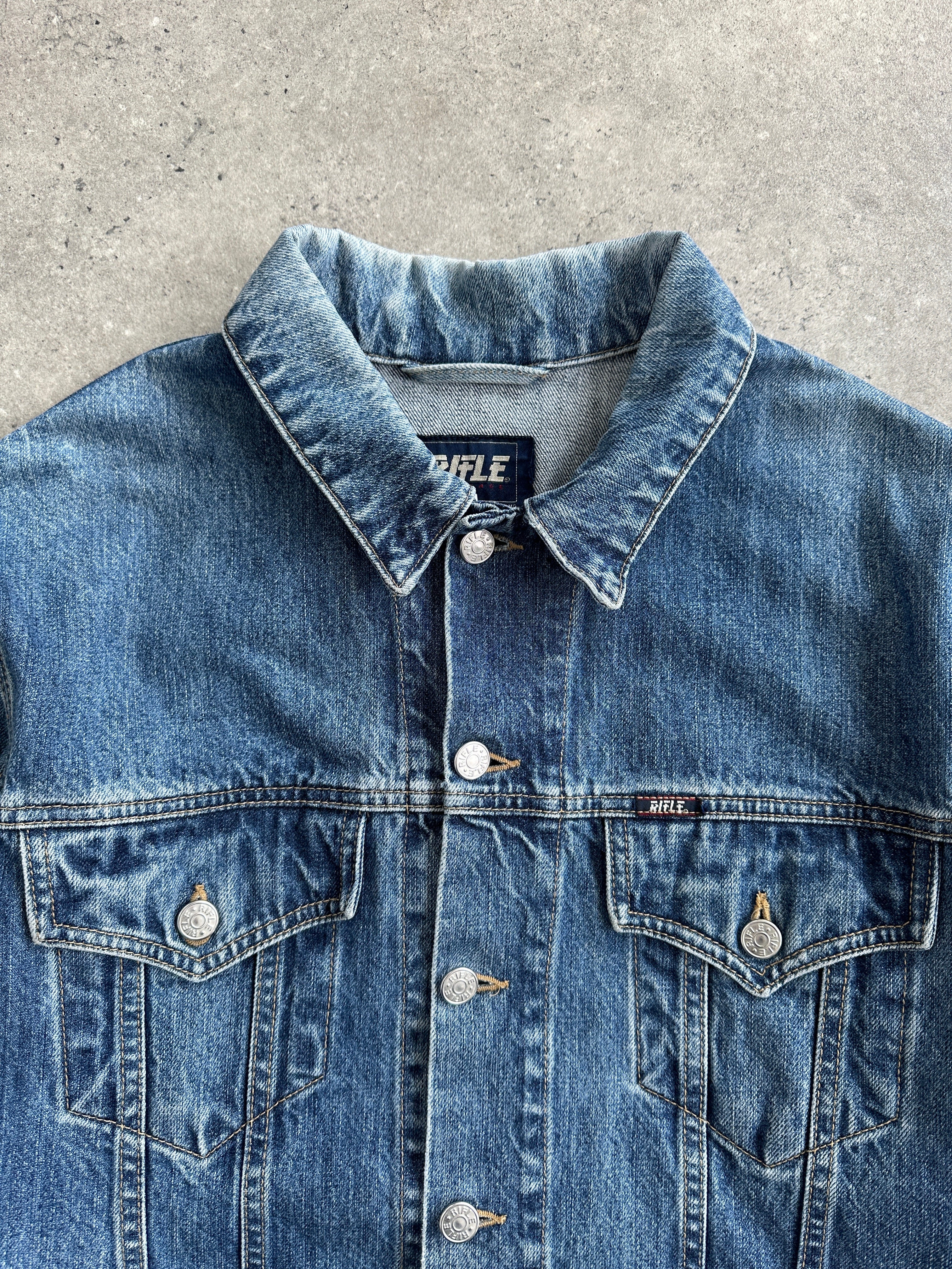 Vintage pure cotton denim jacket in size M, featuring classic blue denim fabric and traditional collar design.