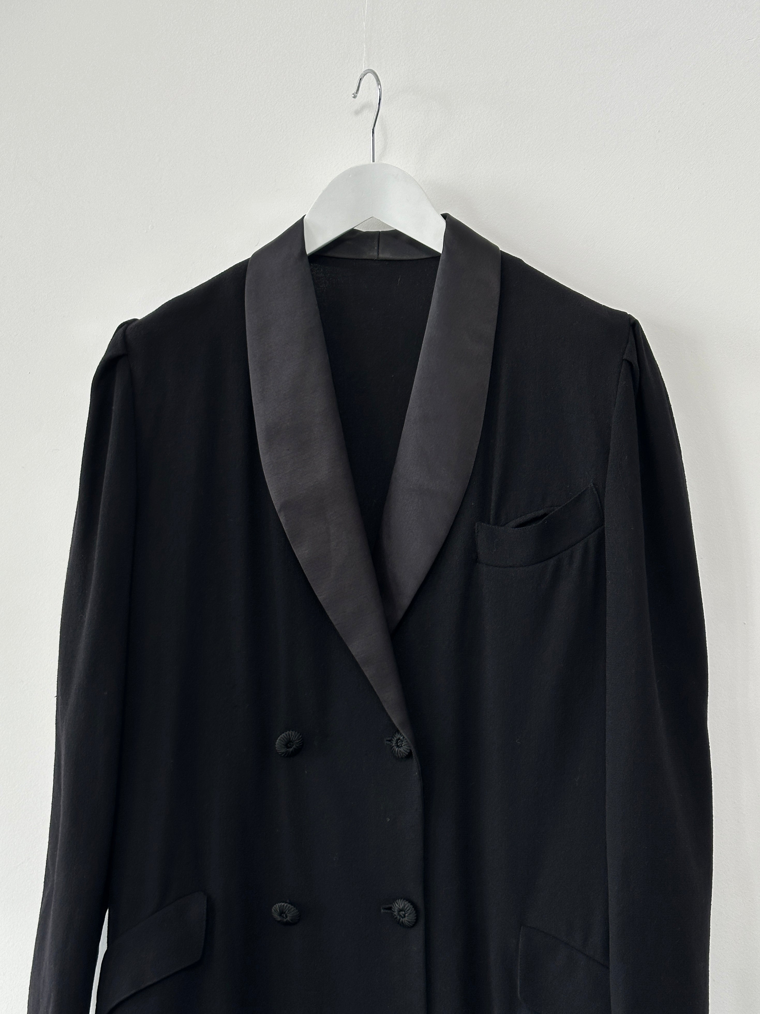 Jaeger men's lightweight wool tuxedo coat with double-breasted design, classic collar, and tailored fit in a neutral color.