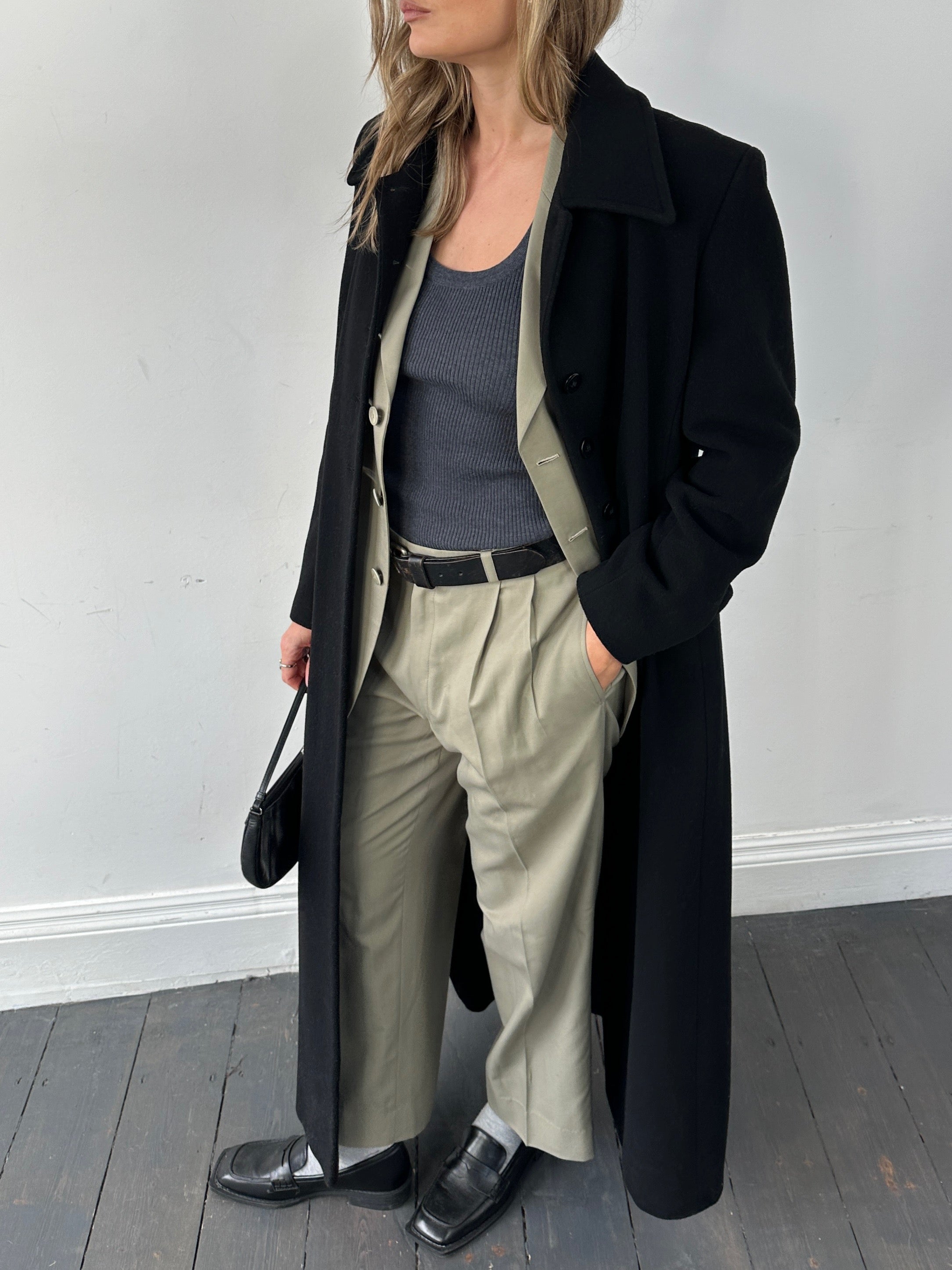 Vintage wool single-breasted A-line coat in size small, featuring classic design and timeless style, shown in natural fabric and tailored fit.