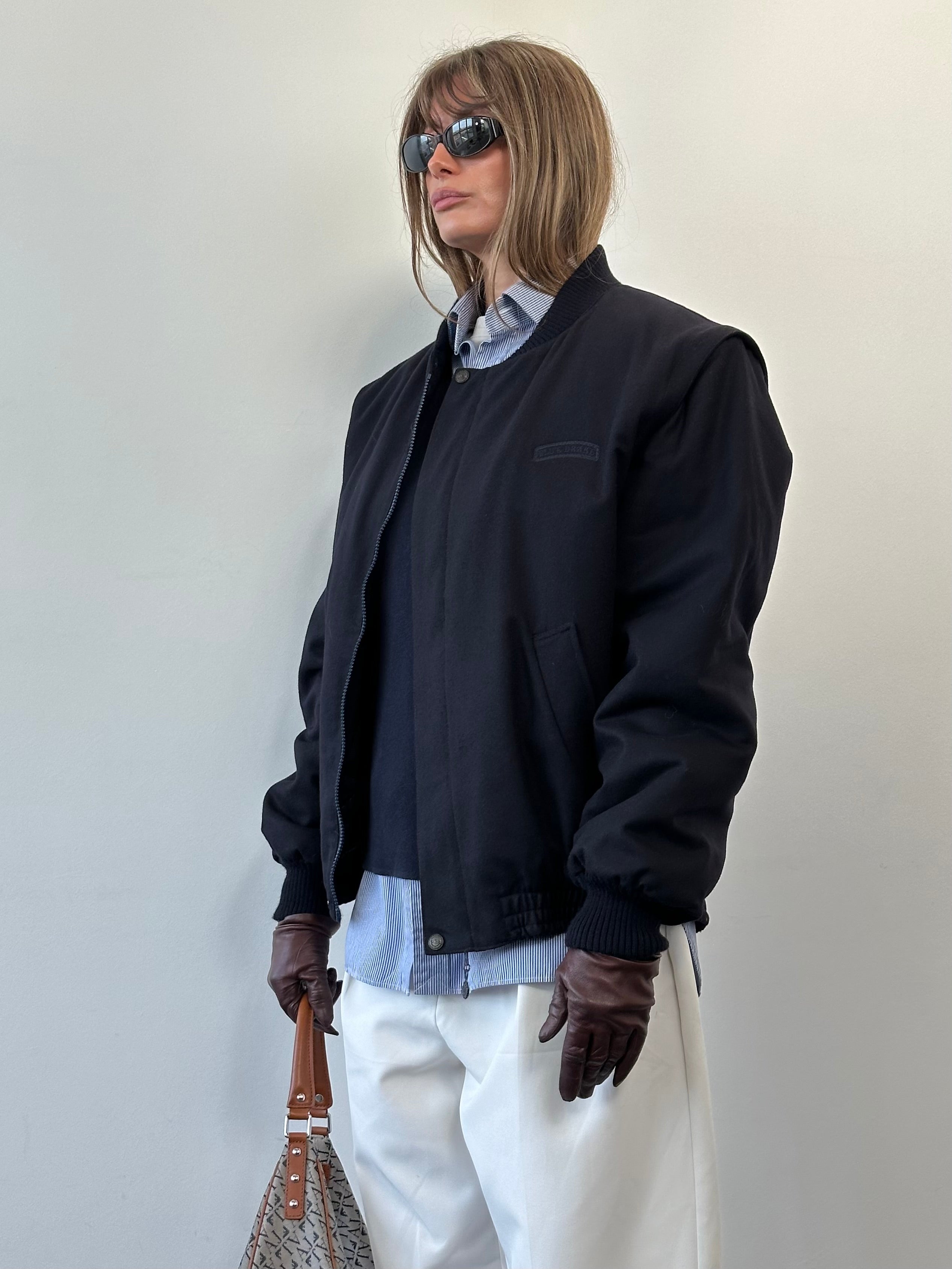 Vintage Italian wool bomber jacket in size large, featuring classic design and textured fabric, displayed on a hanger.