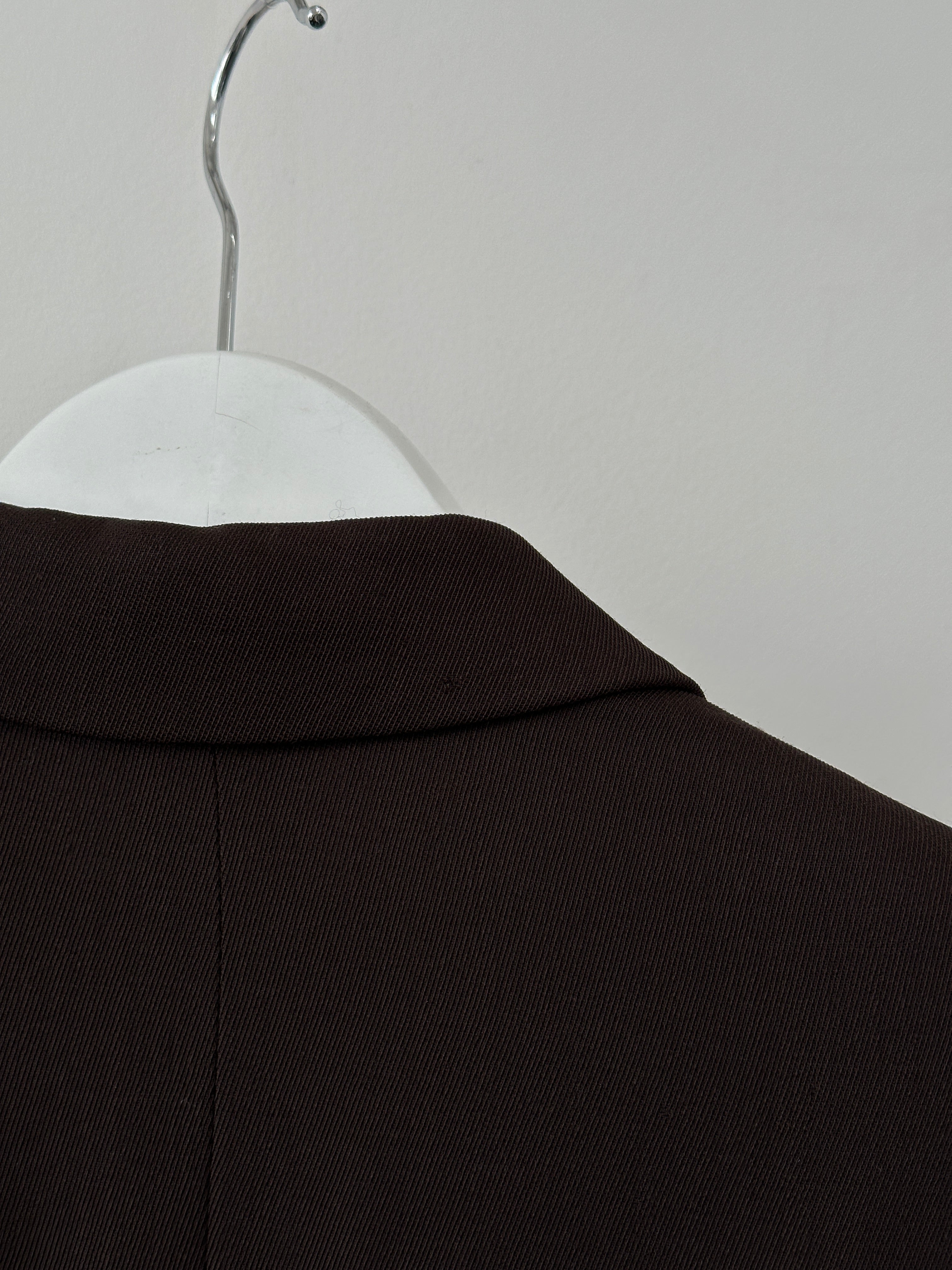 Max Mara virgin wool single-breasted blazer in classic design, shown in a tailored fit with notch lapels and button closure.