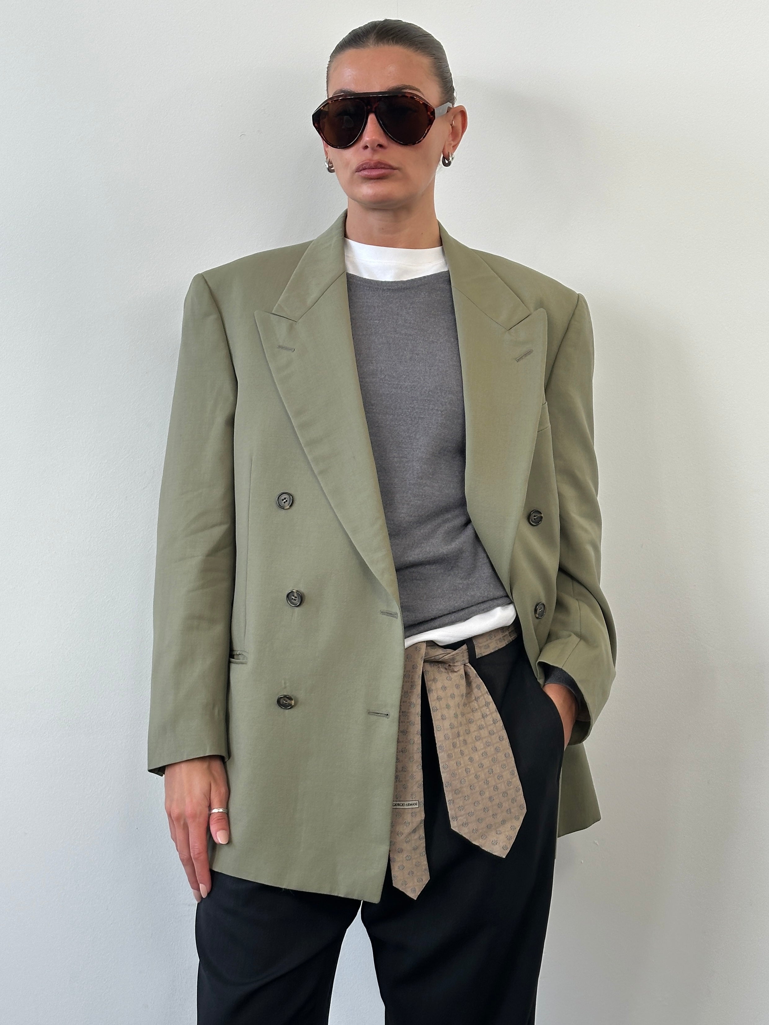 Yves Saint Laurent 1980s pure wool double-breasted blazer in size 40R/L, featuring a classic tailored fit and vintage style.