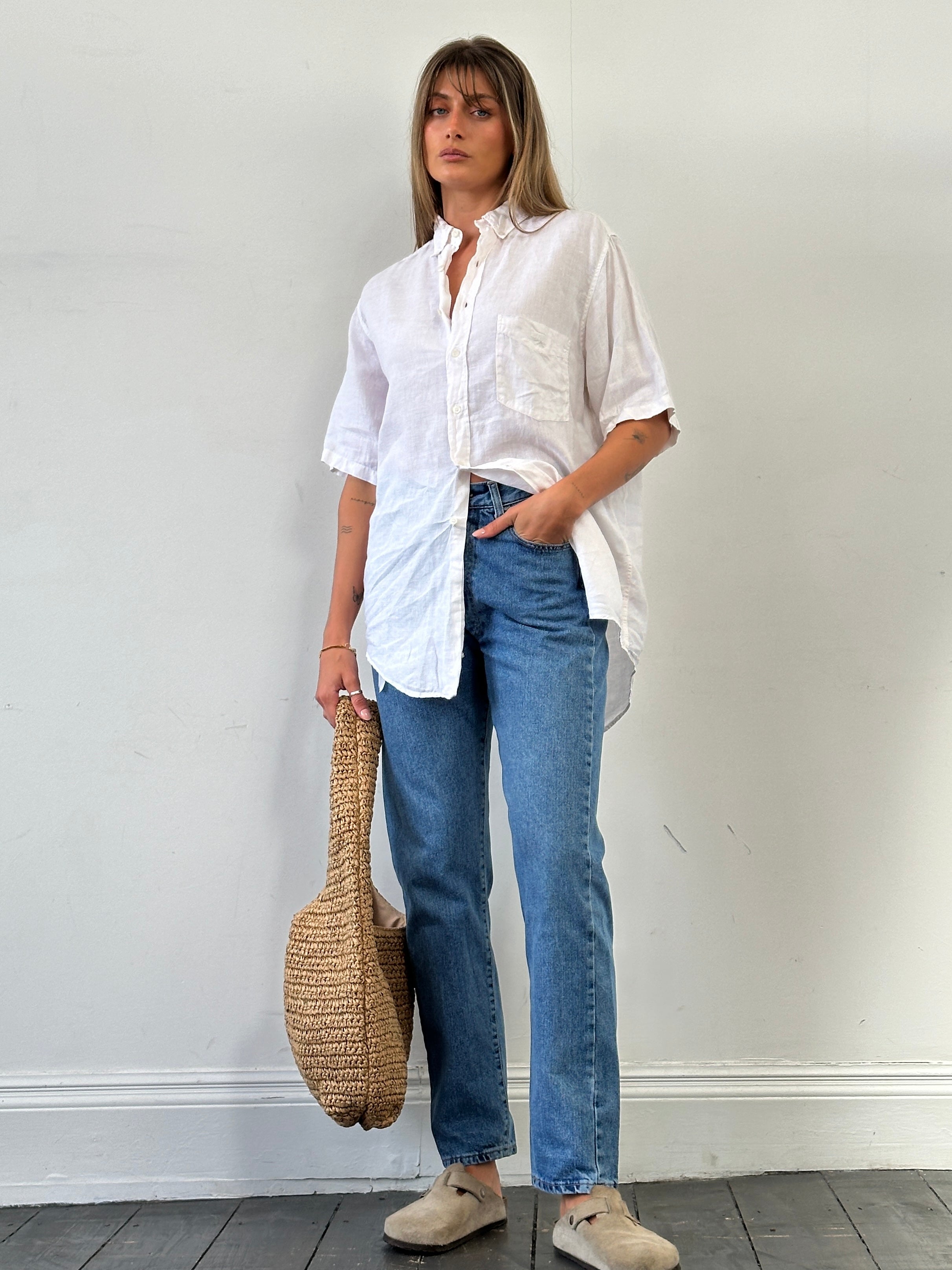 Armani Jeans mid wash tapered leg high waisted denim jeans with belt loops and front pockets, size W28.