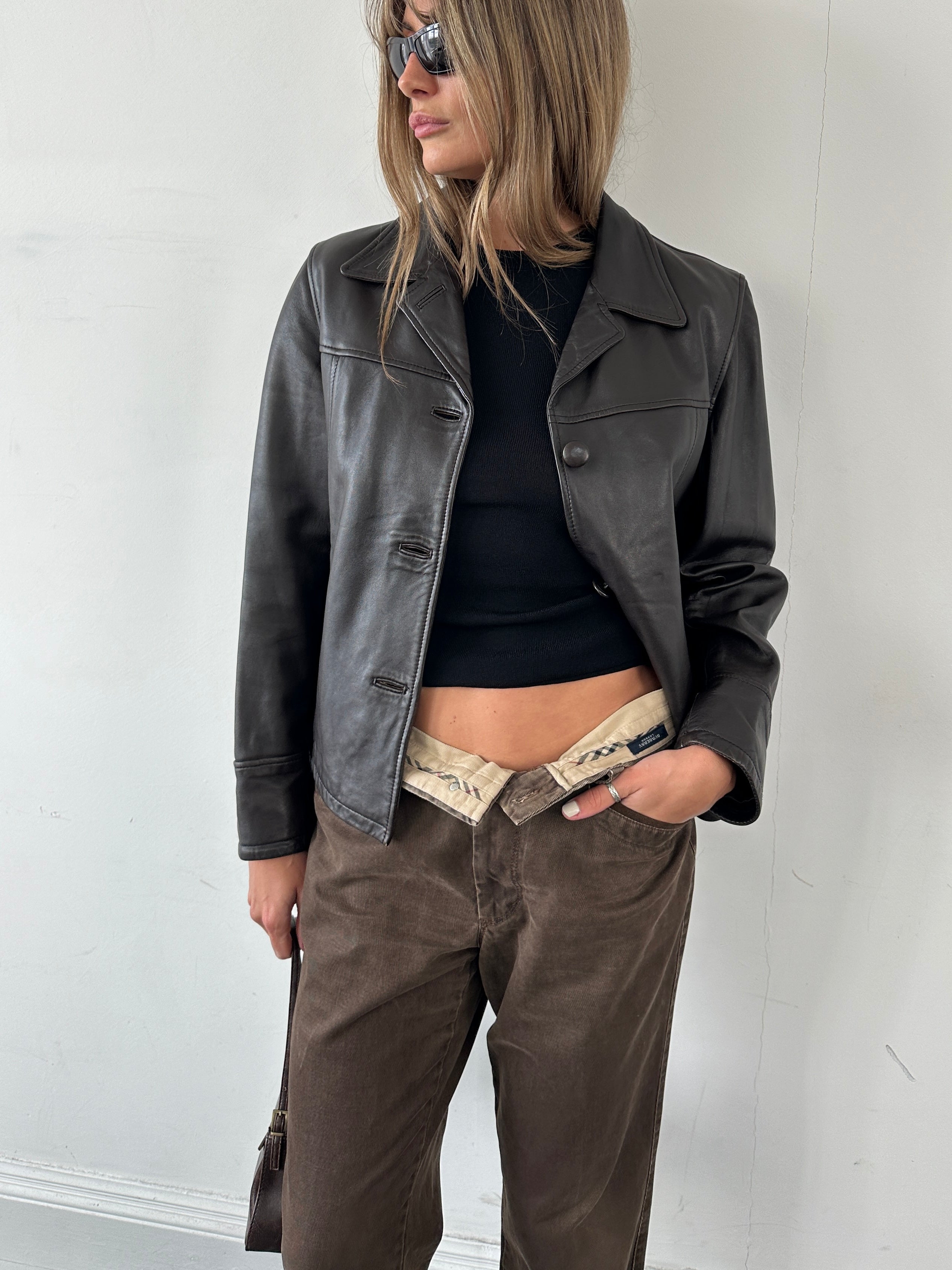 Conbipel men's leather button-up jacket in size S, featuring a classic collar, front buttons, and sleek black leather finish.