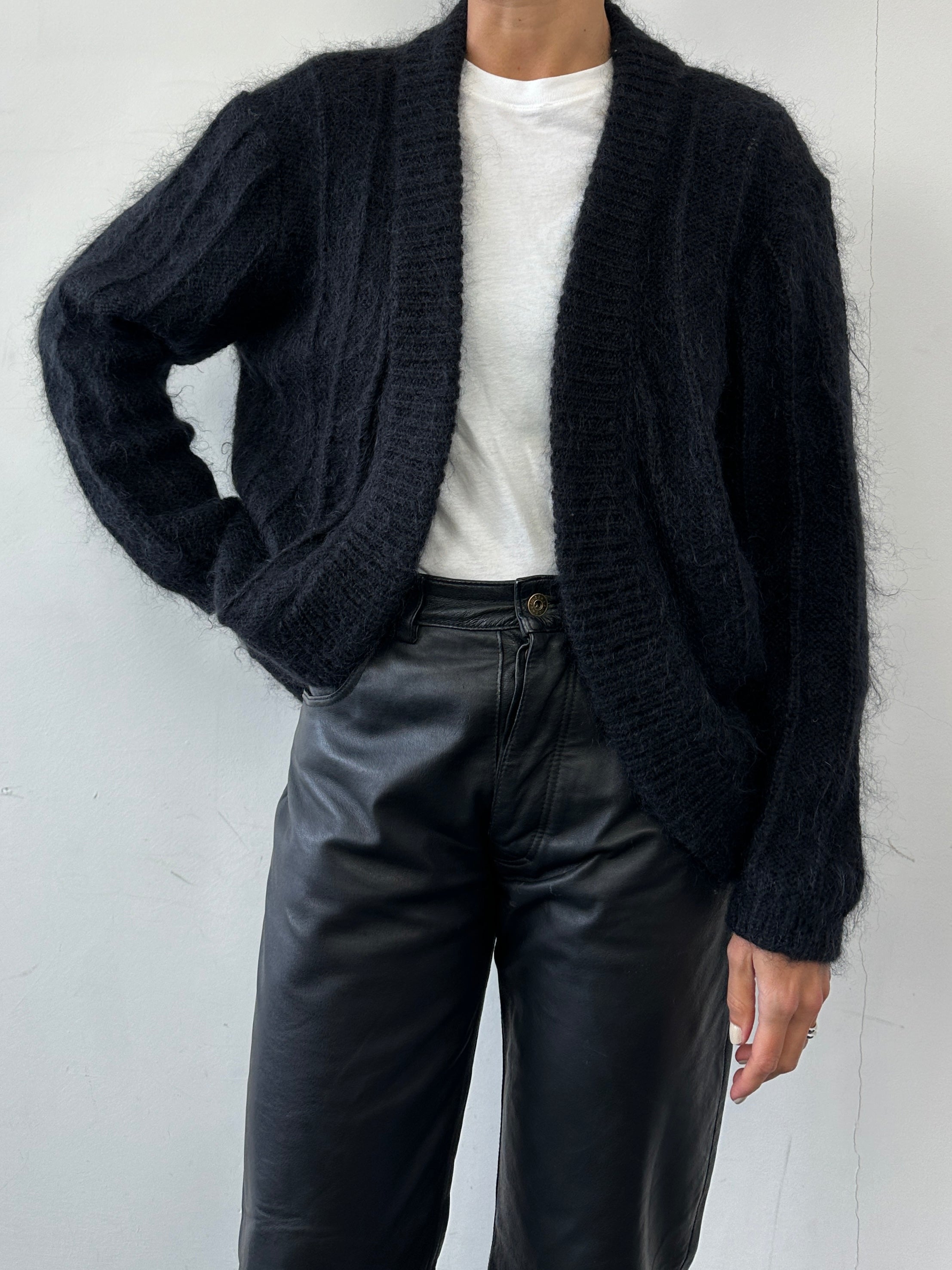 Vintage mohair knitted cardigan in size M, showcasing soft, textured fabric with a classic button-up design and cozy fit.