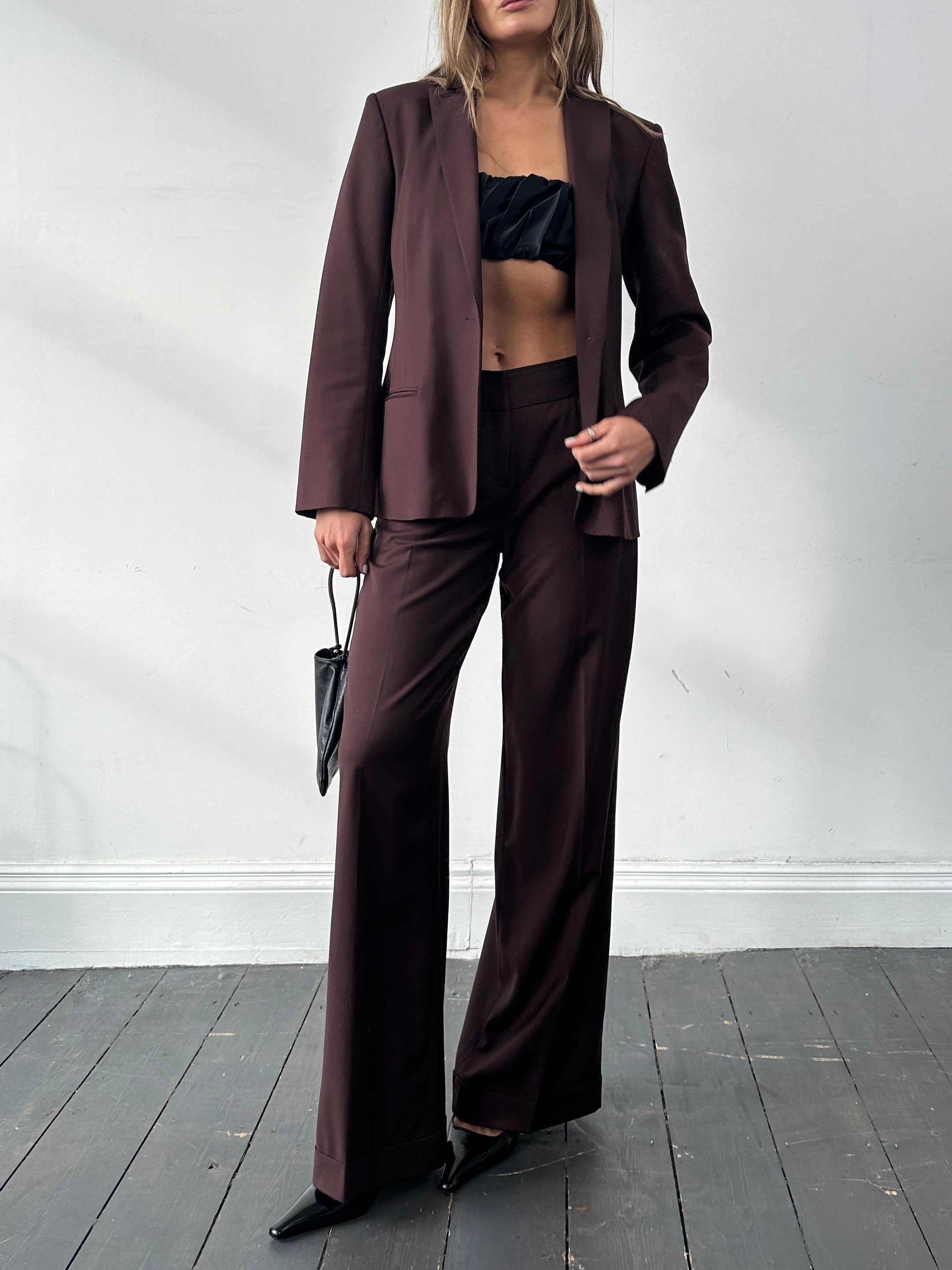 Max Studio wool wide-leg jumpsuit with single-breasted design, tailored fit, and elegant style, shown on a model.