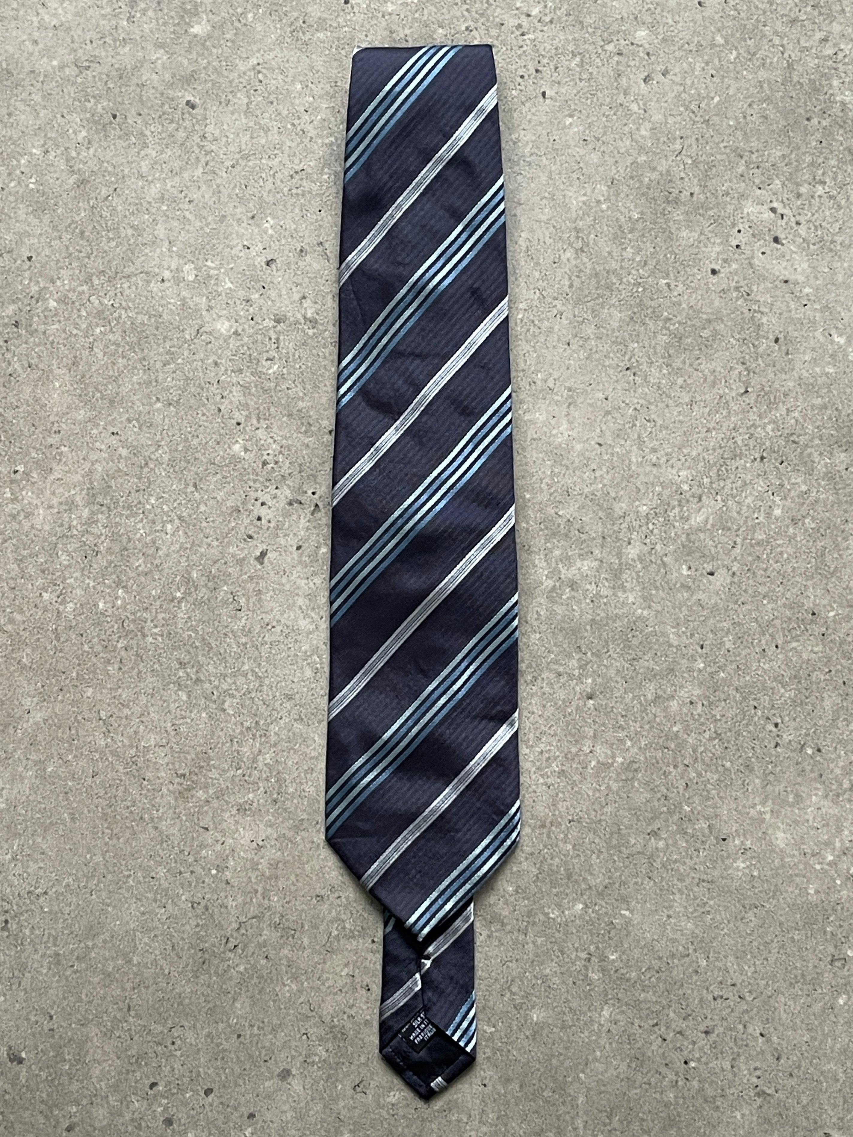 Giorgio Armani 1990s pure silk diagonal striped tie featuring classic blue and white pattern, elegant men's accessory.