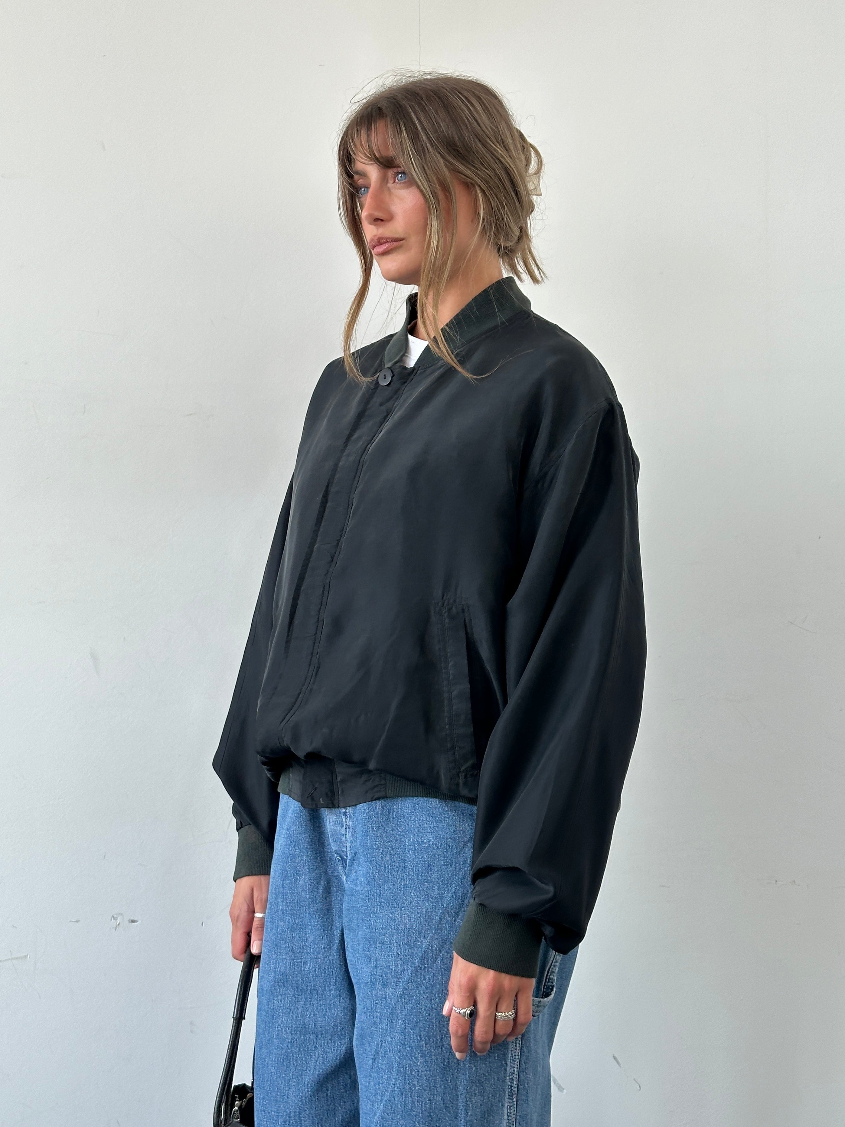 Vintage pure silk bomber jacket in XL, featuring a classic design with a smooth, shiny finish and ribbed collar and cuffs.